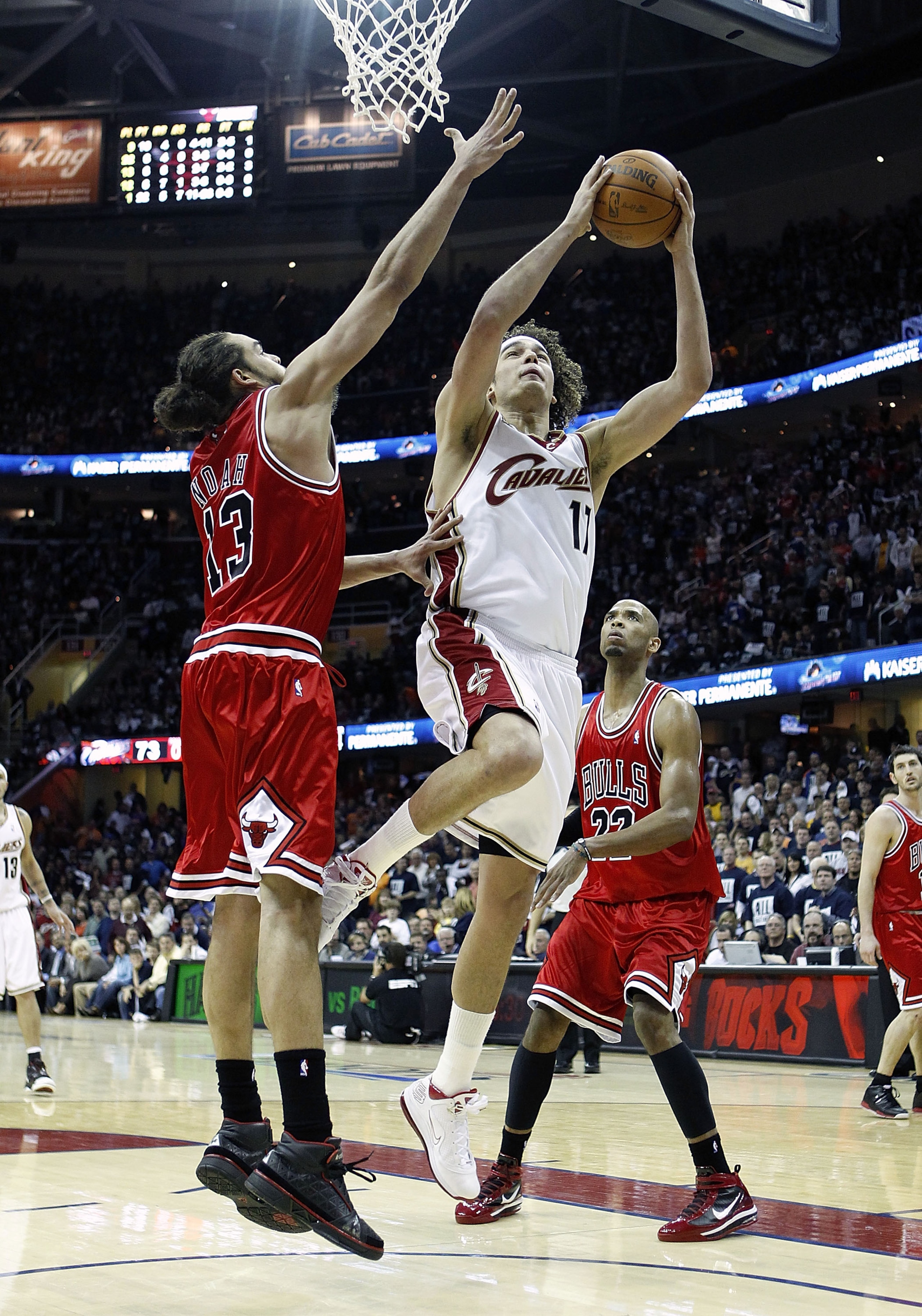 CLEVELAND - APRIL 17:  Anderson Varejao #17 of the Cleveland Cavaliers gets to the basket between Joakim Noah #13 and Taj Gibson #22 of the Chicago Bulls in Game One of the Eastern Conference Quarterfinals during the 2010 NBA Playoffs at Quicken Loans Are