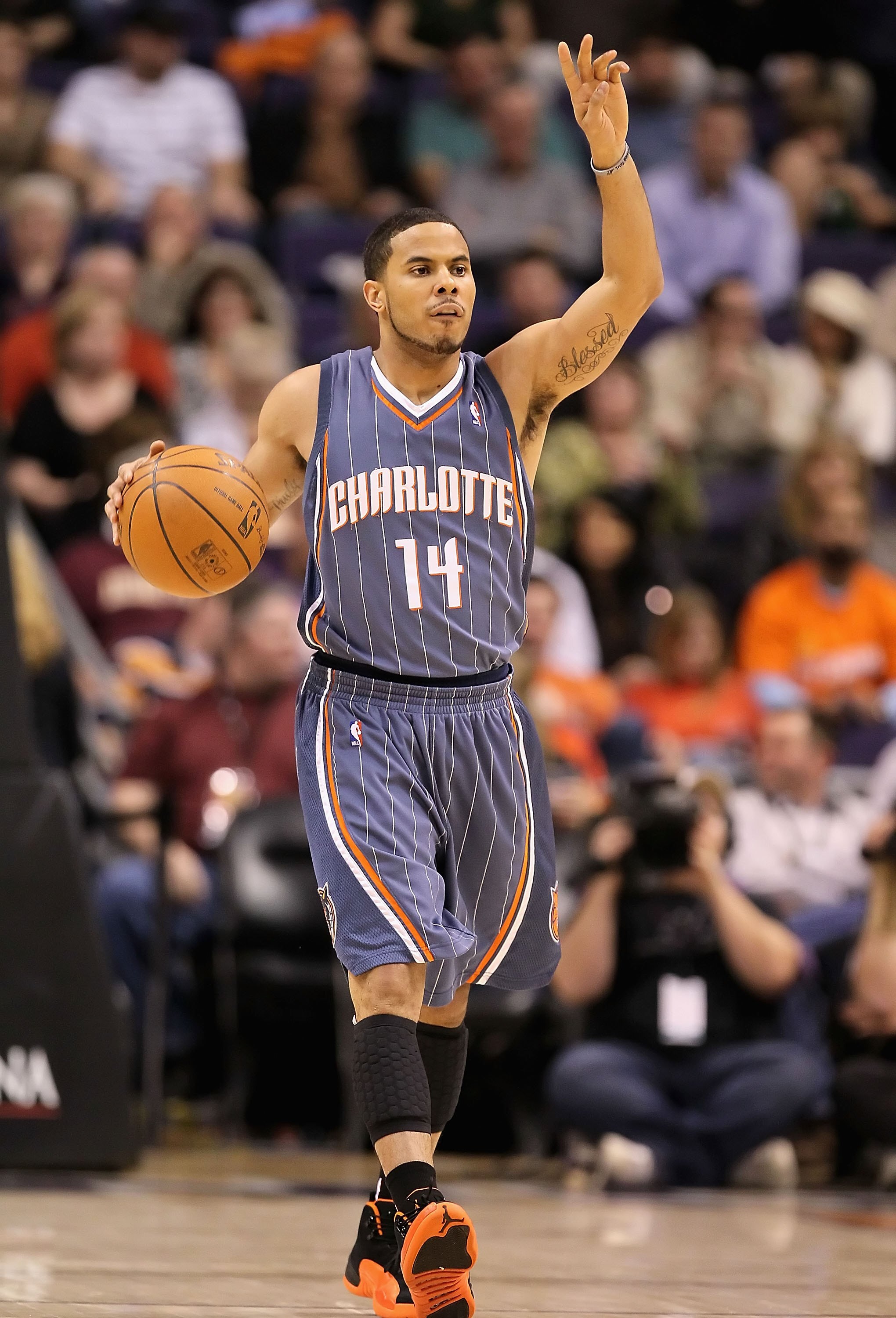 PHOENIX - JANUARY 26:  D.J. Augustin #14 of the Charlotte Bobcats handles the ball during the NBA game against the Phoenix Suns at US Airways Center on January 26, 2010 in Phoenix, Arizona. The Bobcats defeated the Suns in overtime.  114-109.  NOTE TO USE
