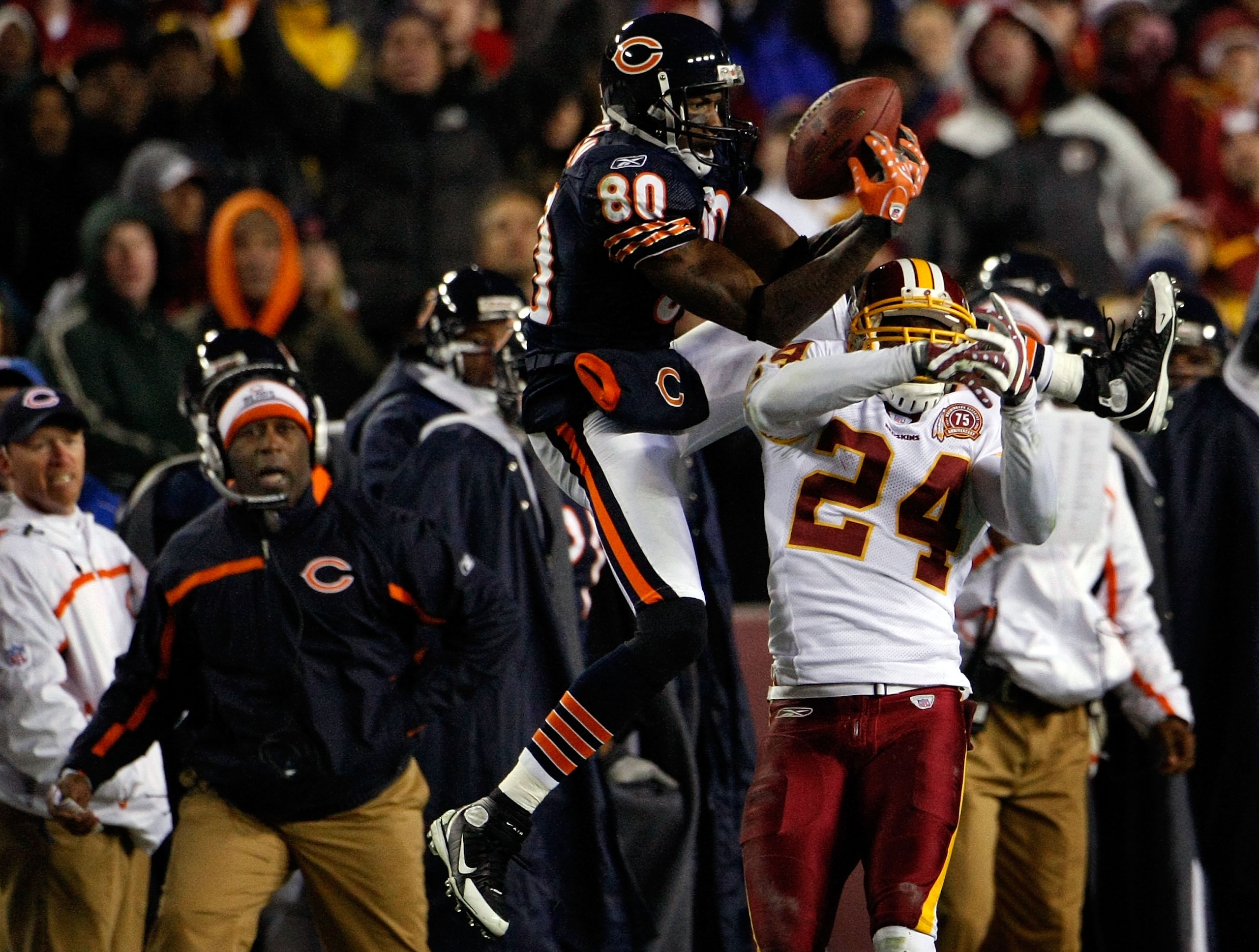 WASHINGTON - DECEMBER 06:  Wide receiver Bernard Berrian #80 of the Chicago Bears catches a pass over cornerback Shawn Springs #24 of the Washington Redskins in third quarter action at FedEx Field December 6, 2007 in Landover, Maryland. The Redskins won t