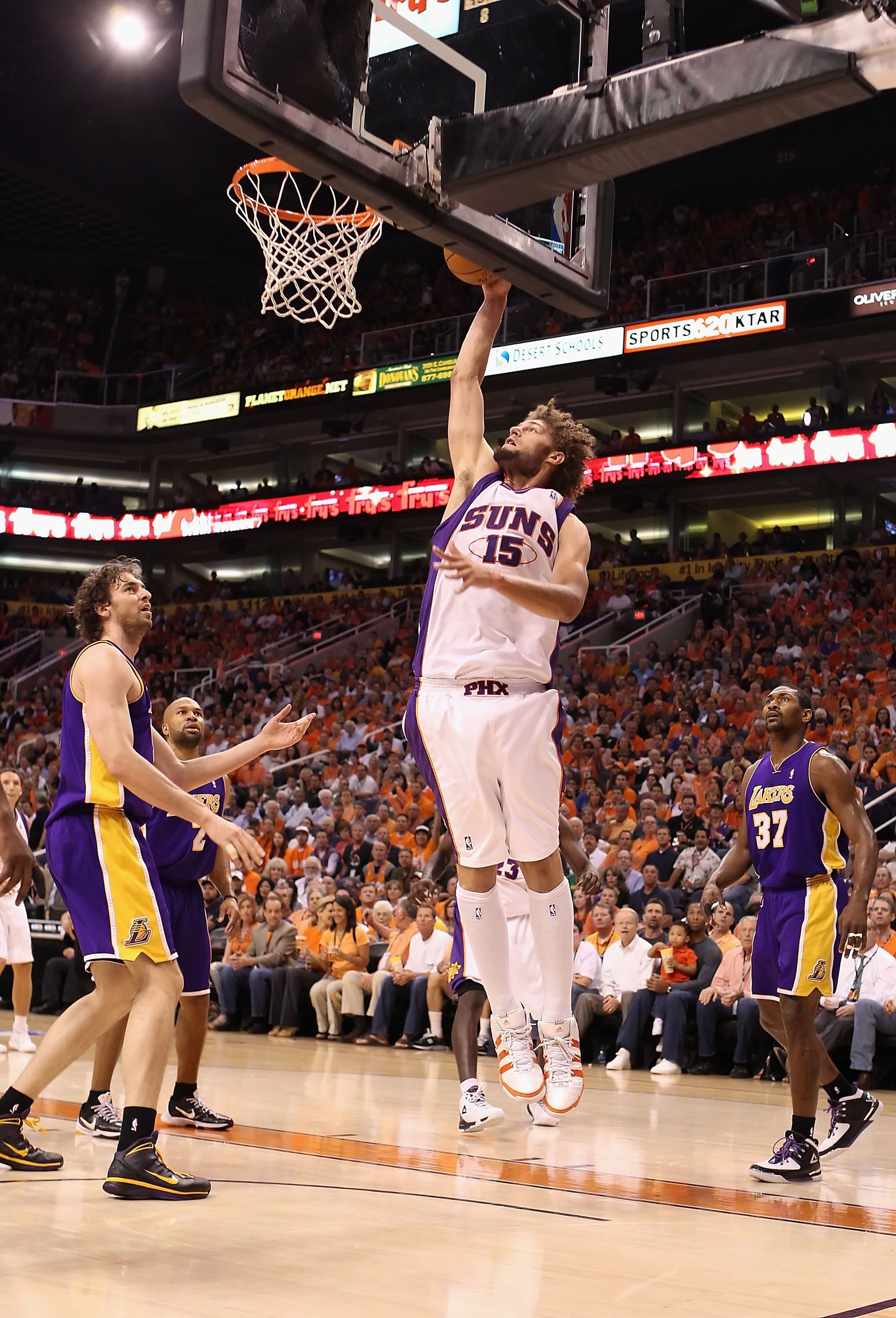 PHOENIX - MAY 25:  Robin Lopez #15 of the Phoenix Suns slam dunks during Game Four of the Western Conference finals of the 2010 NBA Playoffs against the Los Angeles Lakers at US Airways Center on May 25, 2010 in Phoenix, Arizona. The Suns defeated the Lak