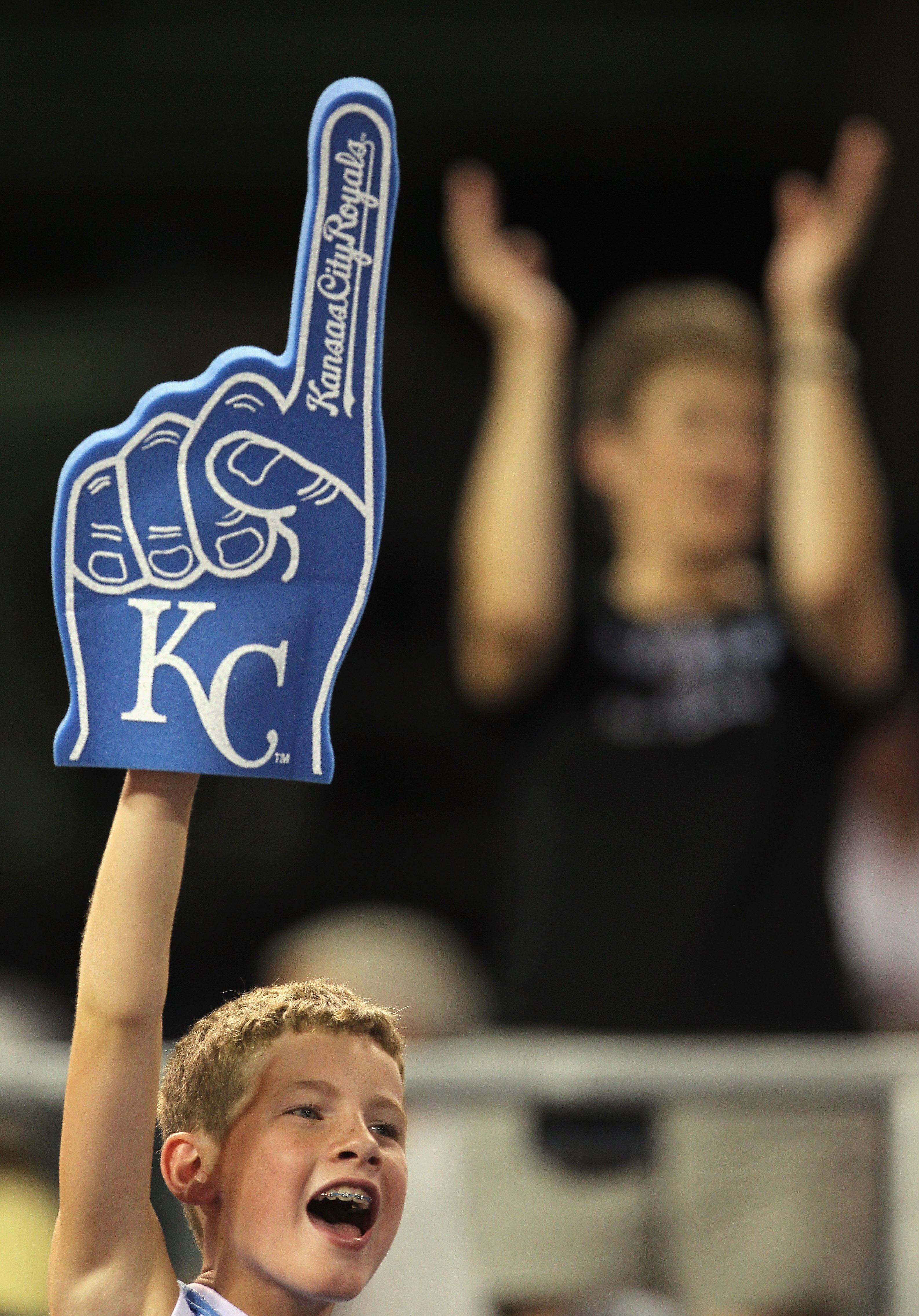 KANSAS CITY, MO - JULY 19:  A young fan cheers during the 10th inning of the game between the Toronto Blue Jays and the Kansas City Royals on July 19, 2010 at Kauffman Stadium in Kansas City, Missouri. The Royals defeated the Blue Jays 5-4.  (Photo by Jam