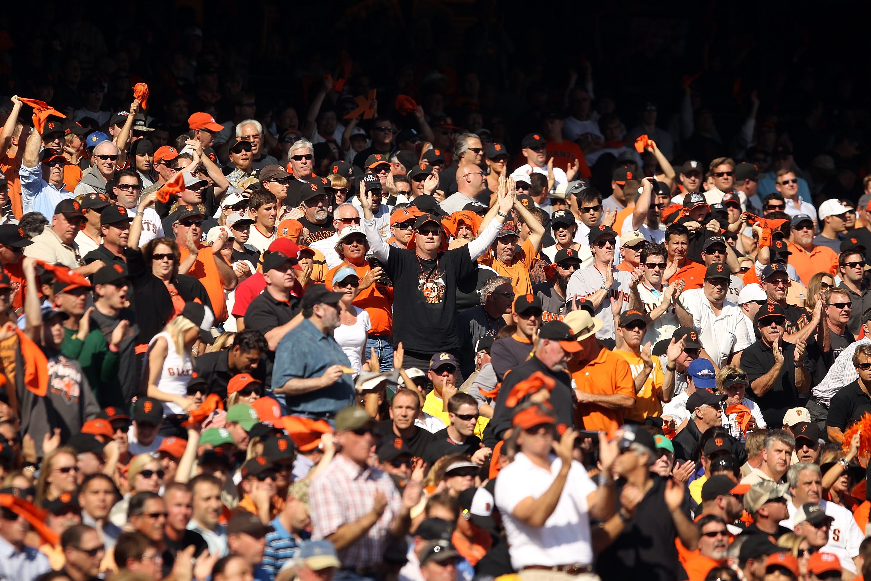 SAN FRANCISCO - OCTOBER 19:  Fans of the San Francisco Giants cheer during Game Three of the NLCS against the Philadelphia Phillies during the 2010 MLB Playoffs at AT&T Park on October 19, 2010 in San Francisco, California.  (Photo by Ezra Shaw/Getty Imag