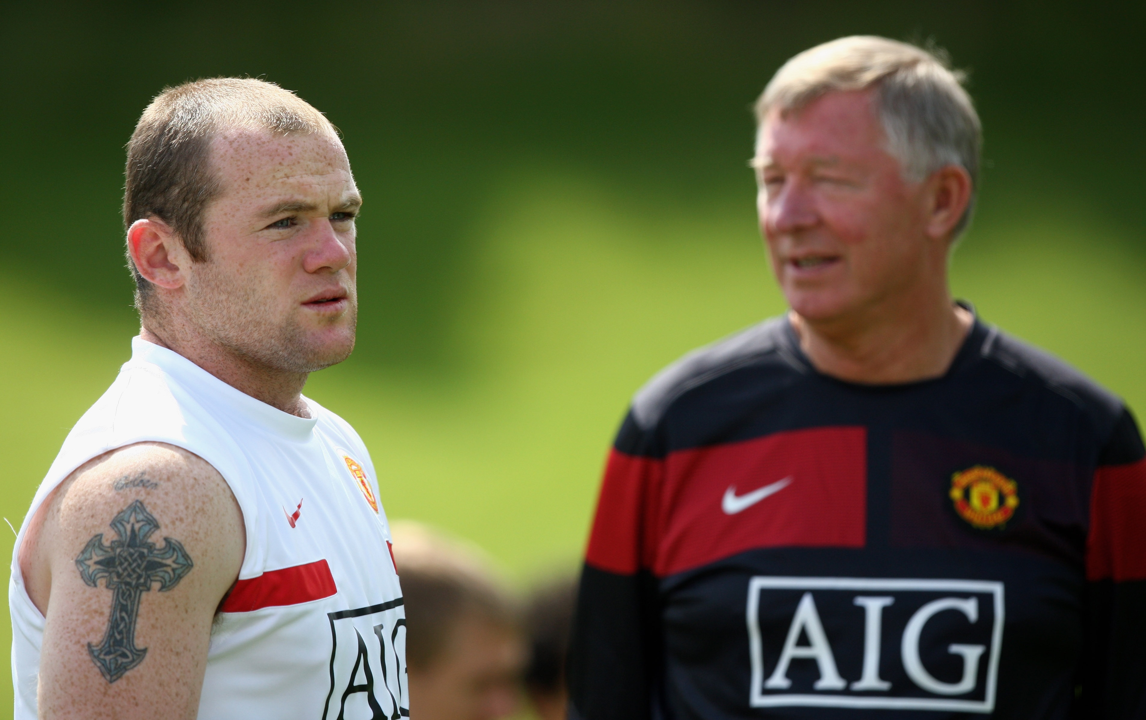 MUNICH, GERMANY - JULY 28:  (L-R) Wayne Rooney of Manchester United and Sir Alex Ferguson look on during a training session on July 28, 2009 in Munich, Germany.  (Photo by Miguel Villagran/Getty Images )
