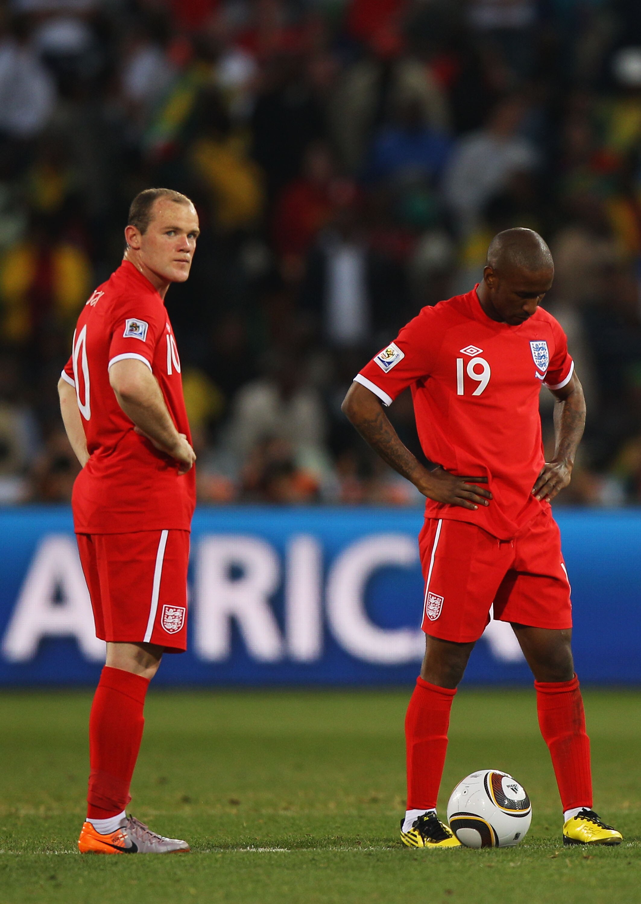 BLOEMFONTEIN, SOUTH AFRICA - JUNE 27:  Jermain Defoe and Wayne Rooney of England look on dejected after Germany score yet another goal during the 2010 FIFA World Cup South Africa Round of Sixteen match between Germany and England at Free State Stadium on 