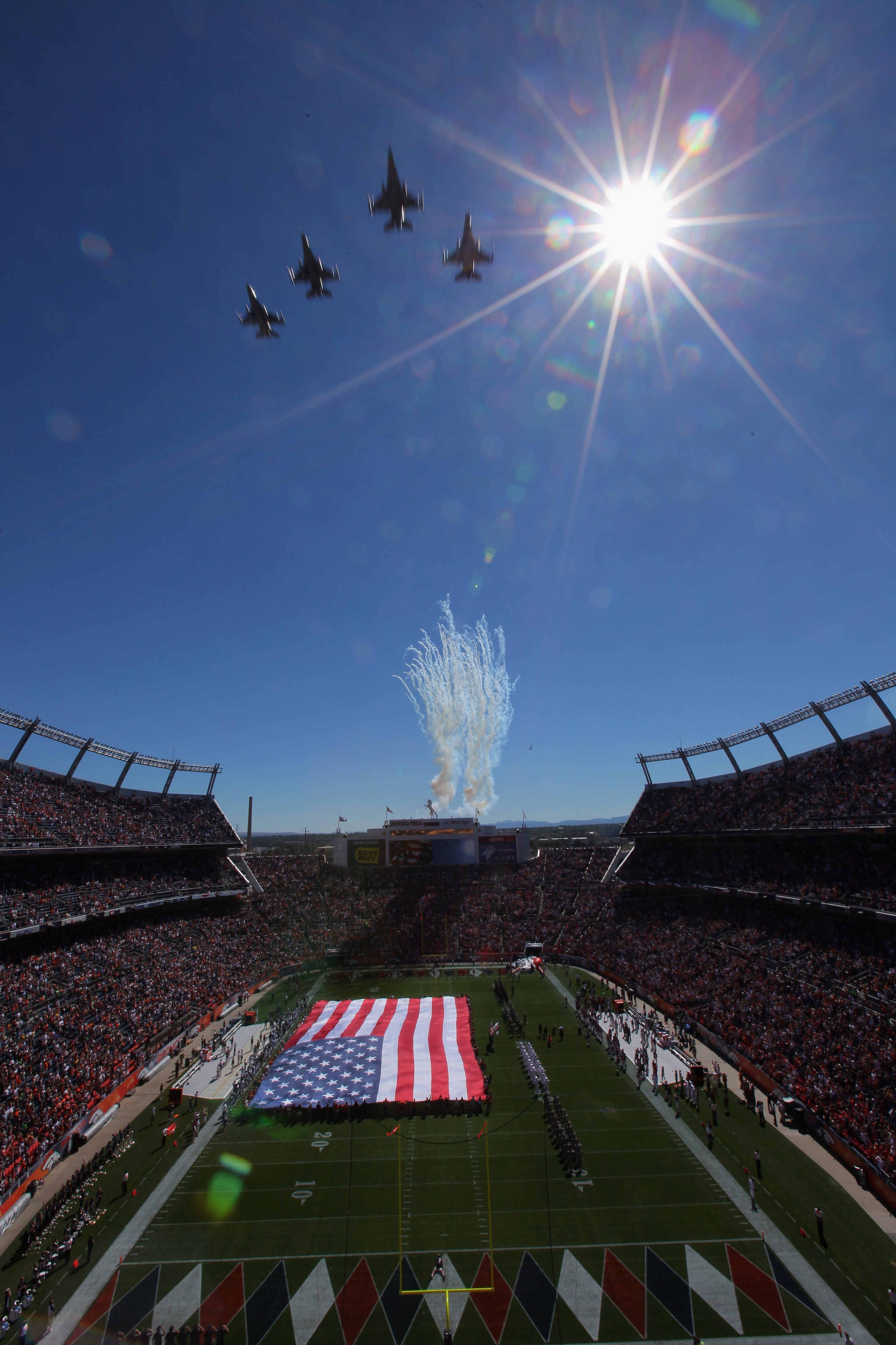 DENVER - SEPTEMBER 19:  US Military jets fly over the stadium as the national anthem is observed as the Seattle Seahawks face the Denver Broncos at INVESCO Field at Mile High on September 19, 2010 in Denver, Colorado. The Broncos defeated the Seahawks 31-