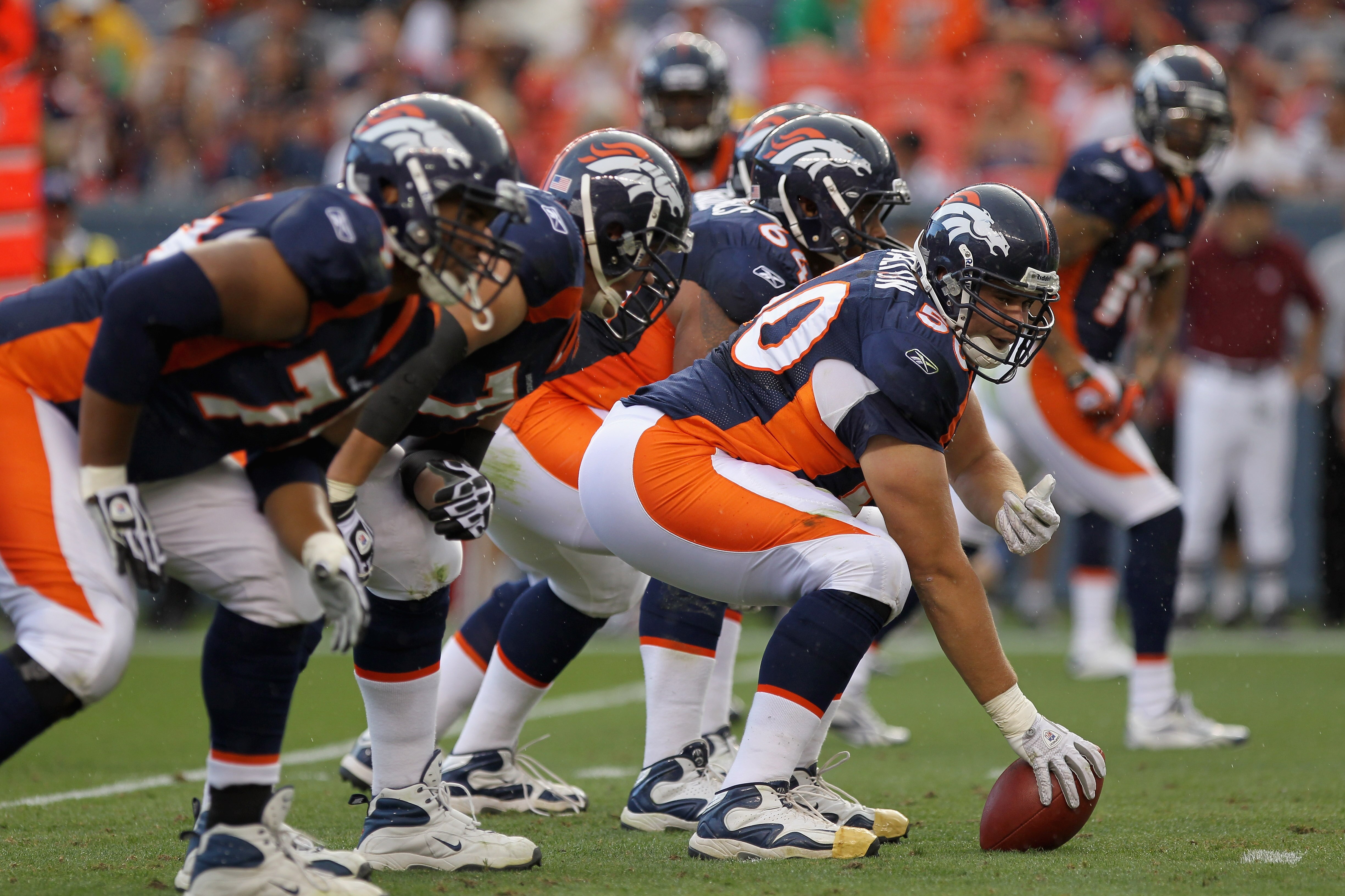 DENVER - AUGUST 29:  Center J.D. Walton #50 of the Denver Broncos leads the offensive line as he  prepares snap the ball against the Pittsburgh Steelers during preseason NFL action at INVESCO Field at Mile High on August 29, 2010 in Denver, Colorado. The