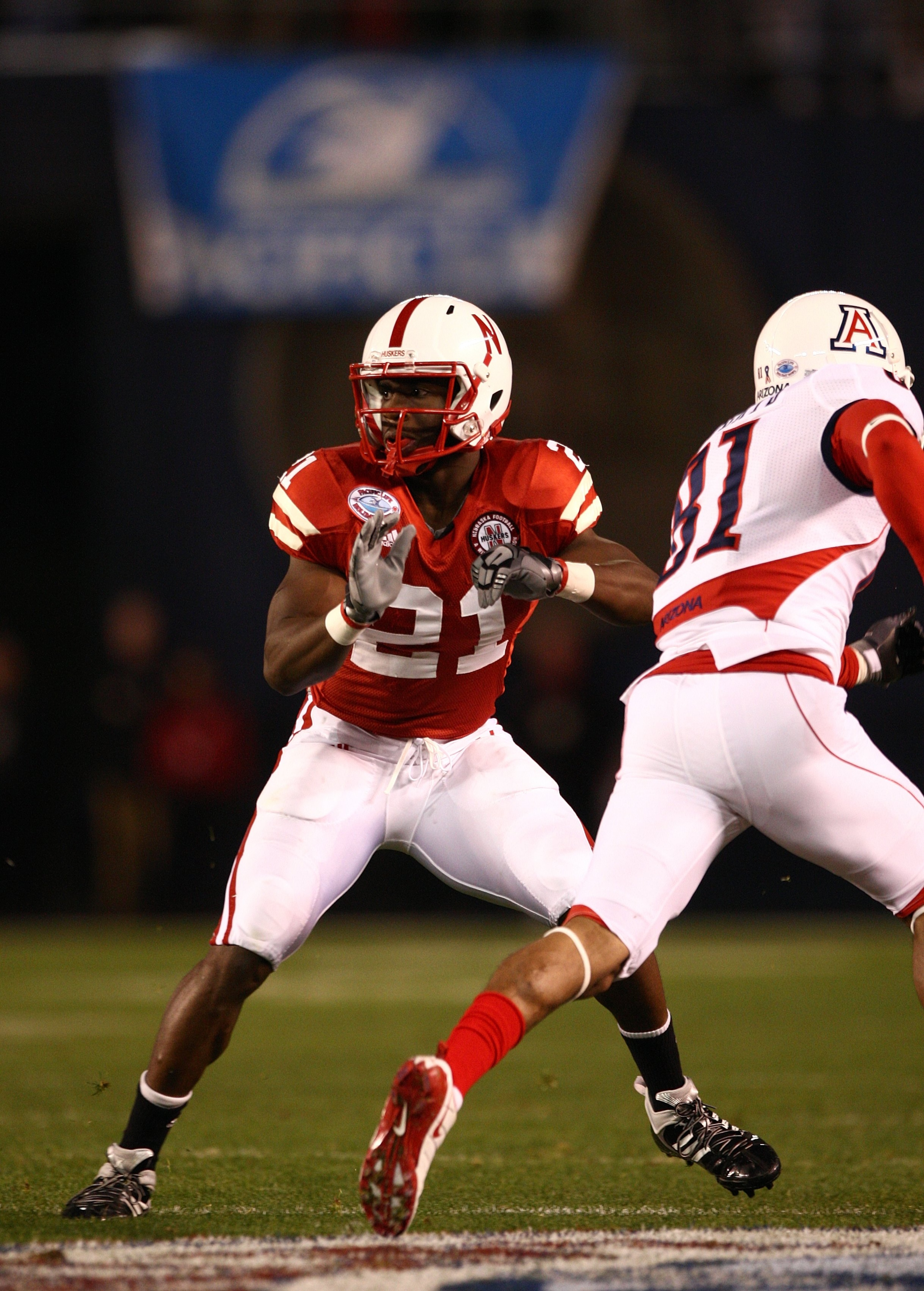 SAN DIEGO - DECEMBER 30:  Prince Amukamara #21 of the University of Nebraska Cornhuskers defends the play during the Pacific Life Holiday Bowl against University of Arizona Wildcats on December 30, 2009 at Qualcomm Stadium in San Diego, California. The Co