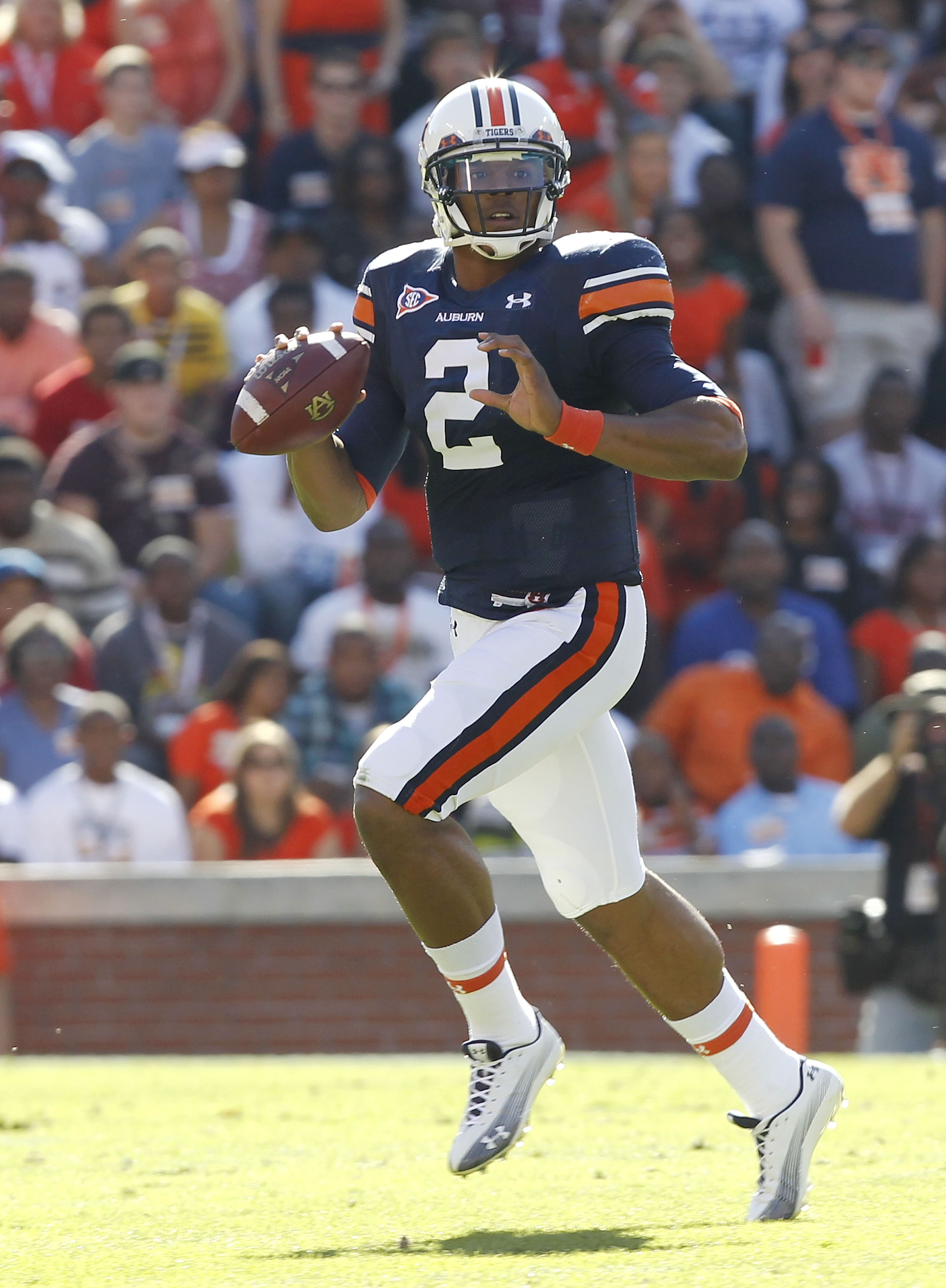 AUBURN, AL - OCTOBER 16:  Quarterback Cam Newton #2 of the Auburn Tigers rolls out and looks downfield for a receiver during the game against the Arkansas Razorbacks at Jordan-Hare Stadium on October 16, 2010 in Auburn, Alabama.  (Photo by Mike Zarrilli/G