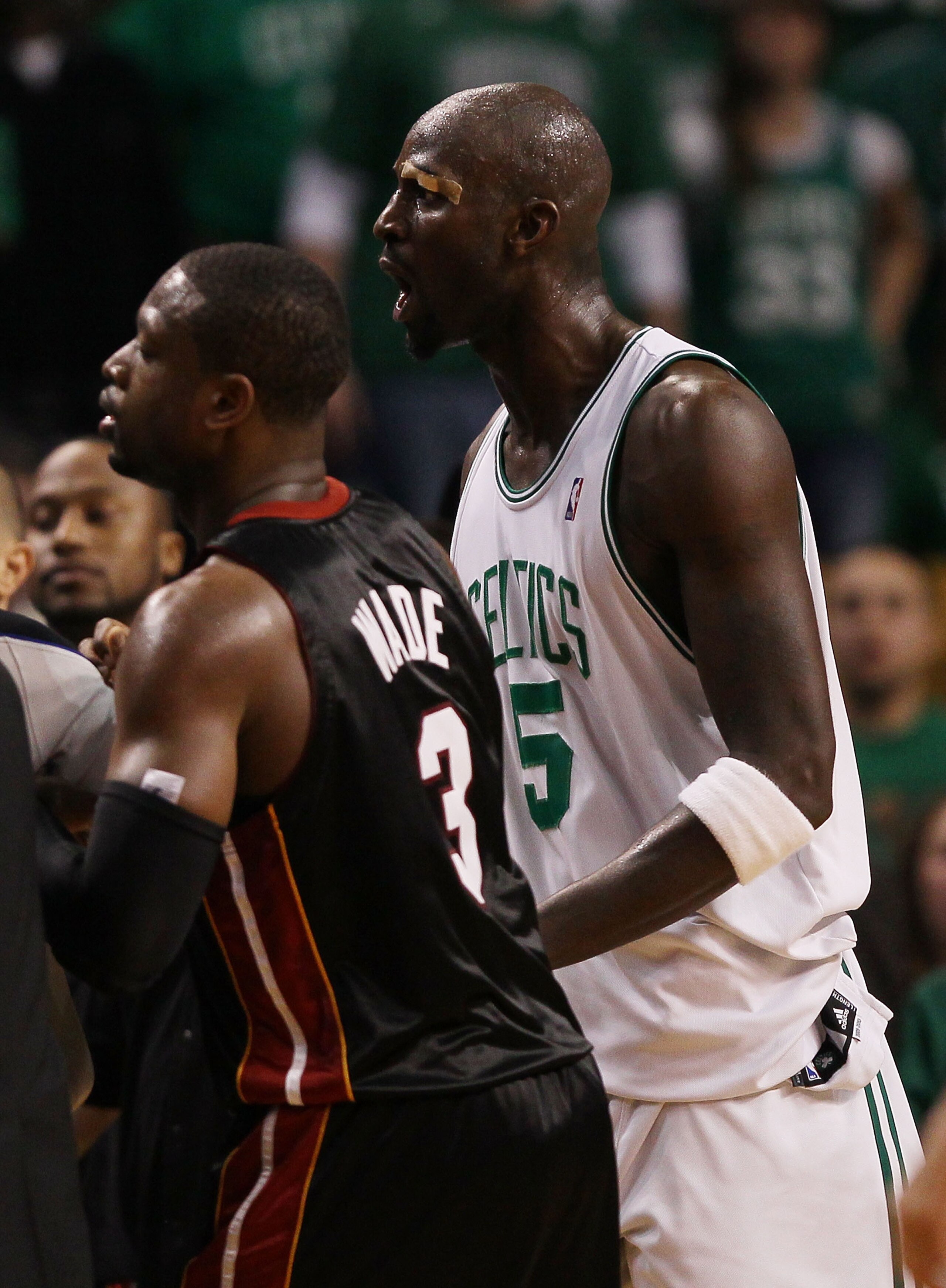 BOSTON - APRIL 17:  Kevin Garnett #5 of the Boston Celtics exchanges words with members of the Miami Heat bench after teammate Paul Pierce was shoved into the Heat bench during Game One of the Eastern Conference Quarterfinals of the 2010 NBA playoffs at t