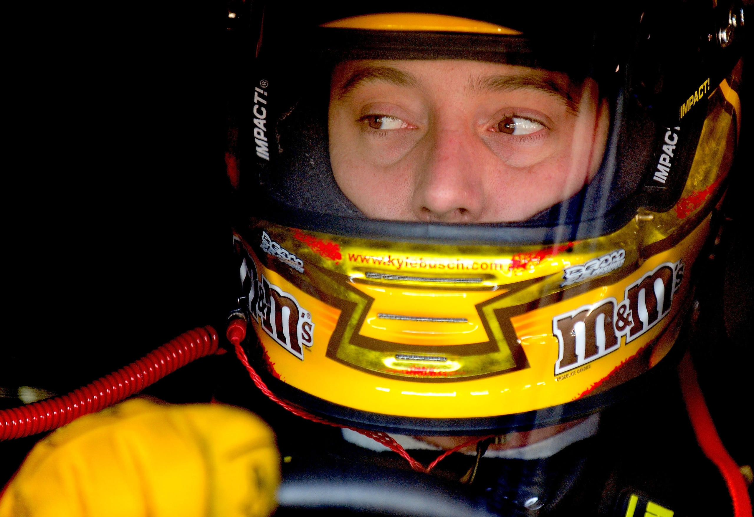 CONCORD, NC - OCTOBER 15:  Kyle Busch, driver of the #18 M&M's Toyota, sits in his car prior to practice for the NASCAR Sprint Cup Series Bank of America 500 at Charlotte Motor Speedway on October 15, 2010 in Concord, North Carolina.  (Photo by Rusty Jarr