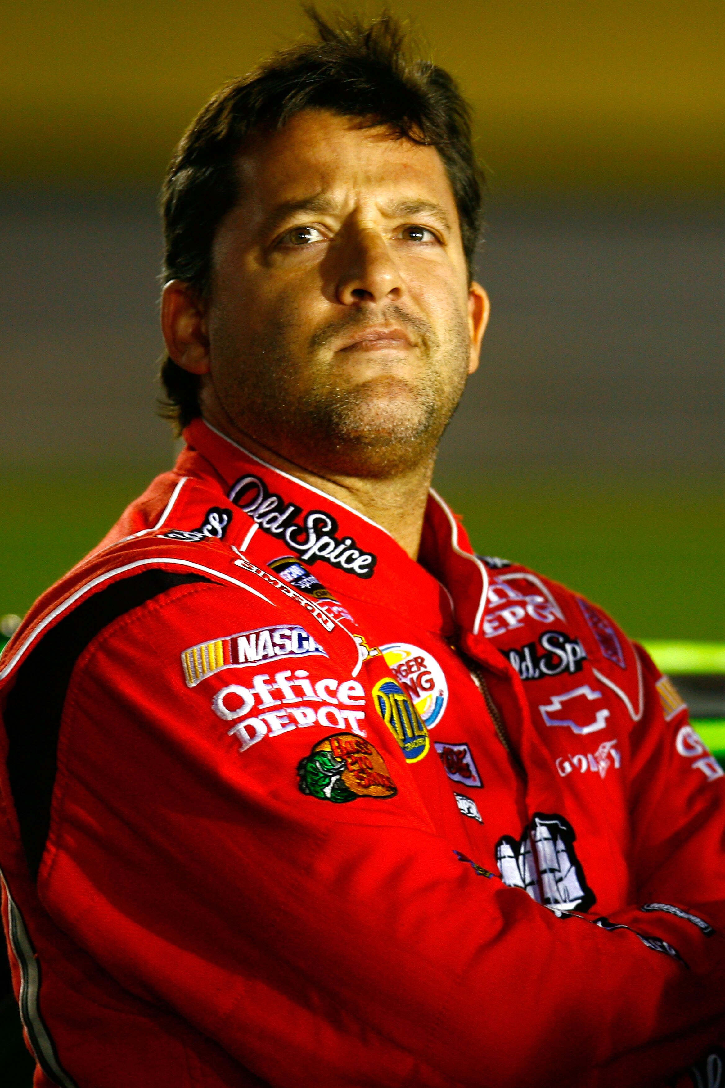 CONCORD, NC - OCTOBER 14:  Tony Stewart, driver of the #14 Office Depot/Old Spice Chevrolet, stands on the grid during qualifying for the NASCAR Sprint Cup Series Bank of America 500 at Charlotte Motor Speedway on October 14, 2010 in Concord, North Caroli