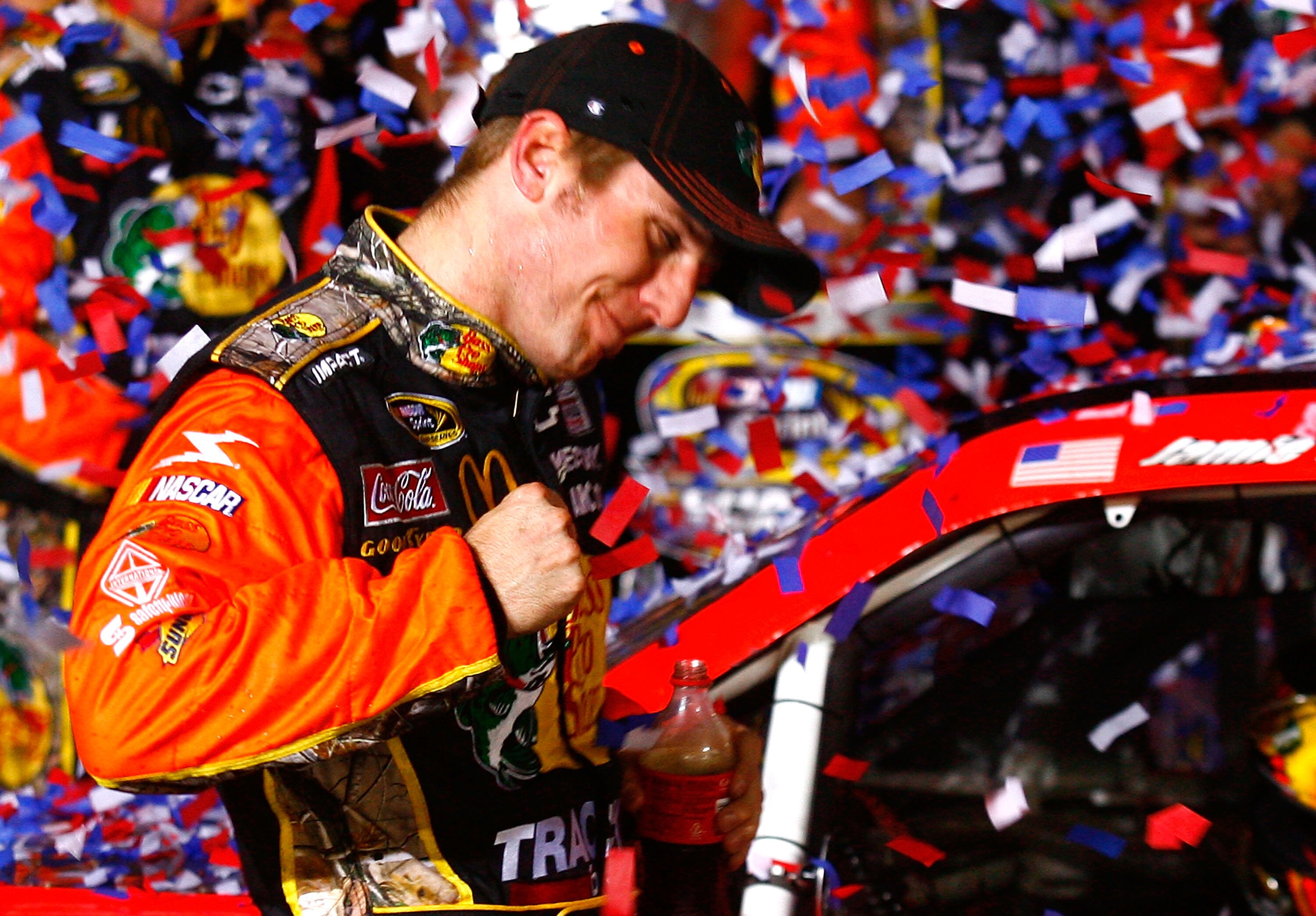 CONCORD, NC - OCTOBER 16:  Jamie McMurray, driver of the #1 Bass Pro Shops/Tracker Boats Chevrolet, celebrates in Victory Lane after winning the NASCAR Sprint Cup Series Bank of America 500 at Charlotte Motor Speedway on October 16, 2010 in Concord, North