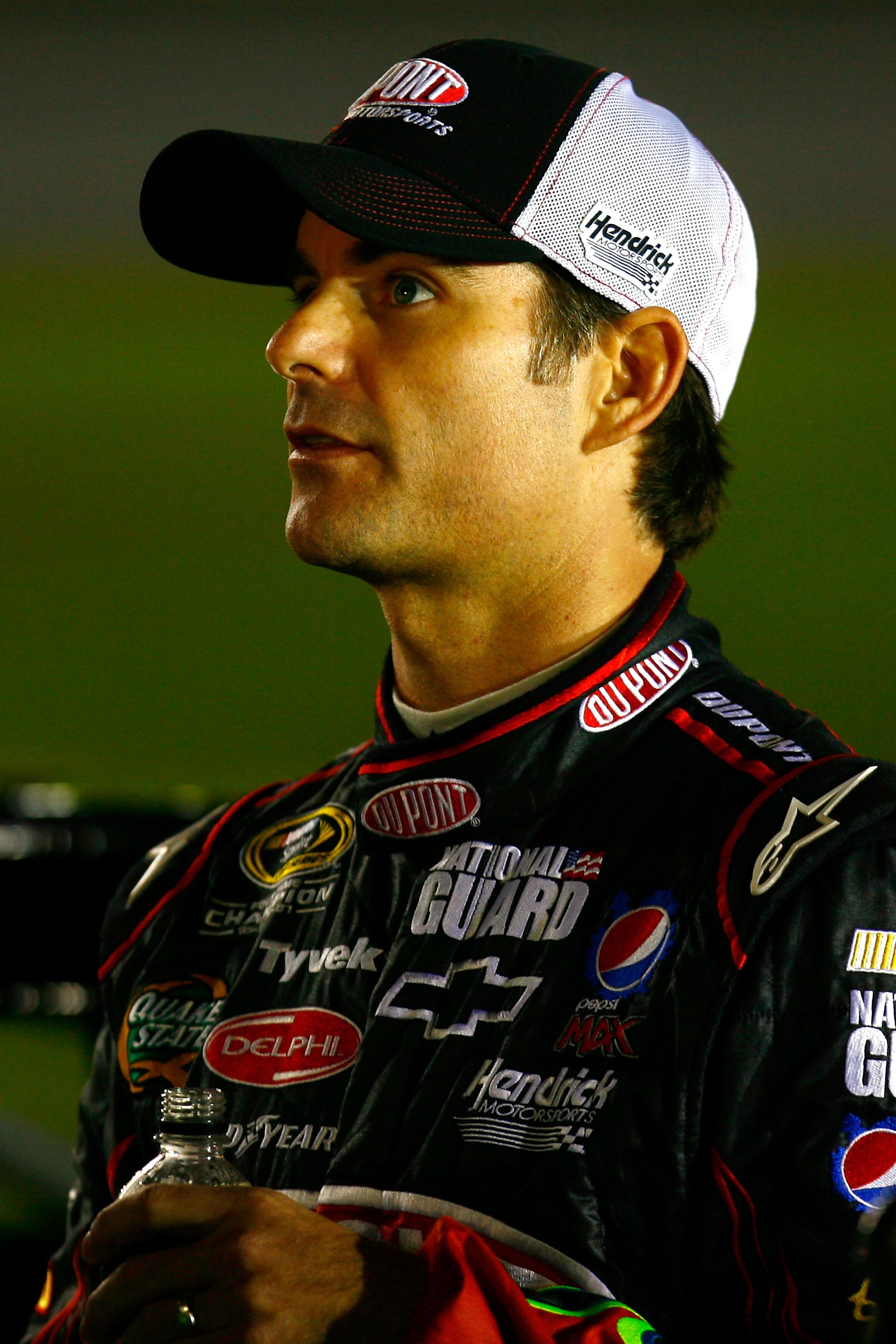 CONCORD, NC - OCTOBER 14: Jeff Gordon, driver of the #24 DuPont Chevrolet, stands on the grid during qualifying for the NASCAR Sprint Cup Series Bank of America 500 at Charlotte Motor Speedway on October 14, 2010 in Concord, North Carolina.  (Photo by Jas