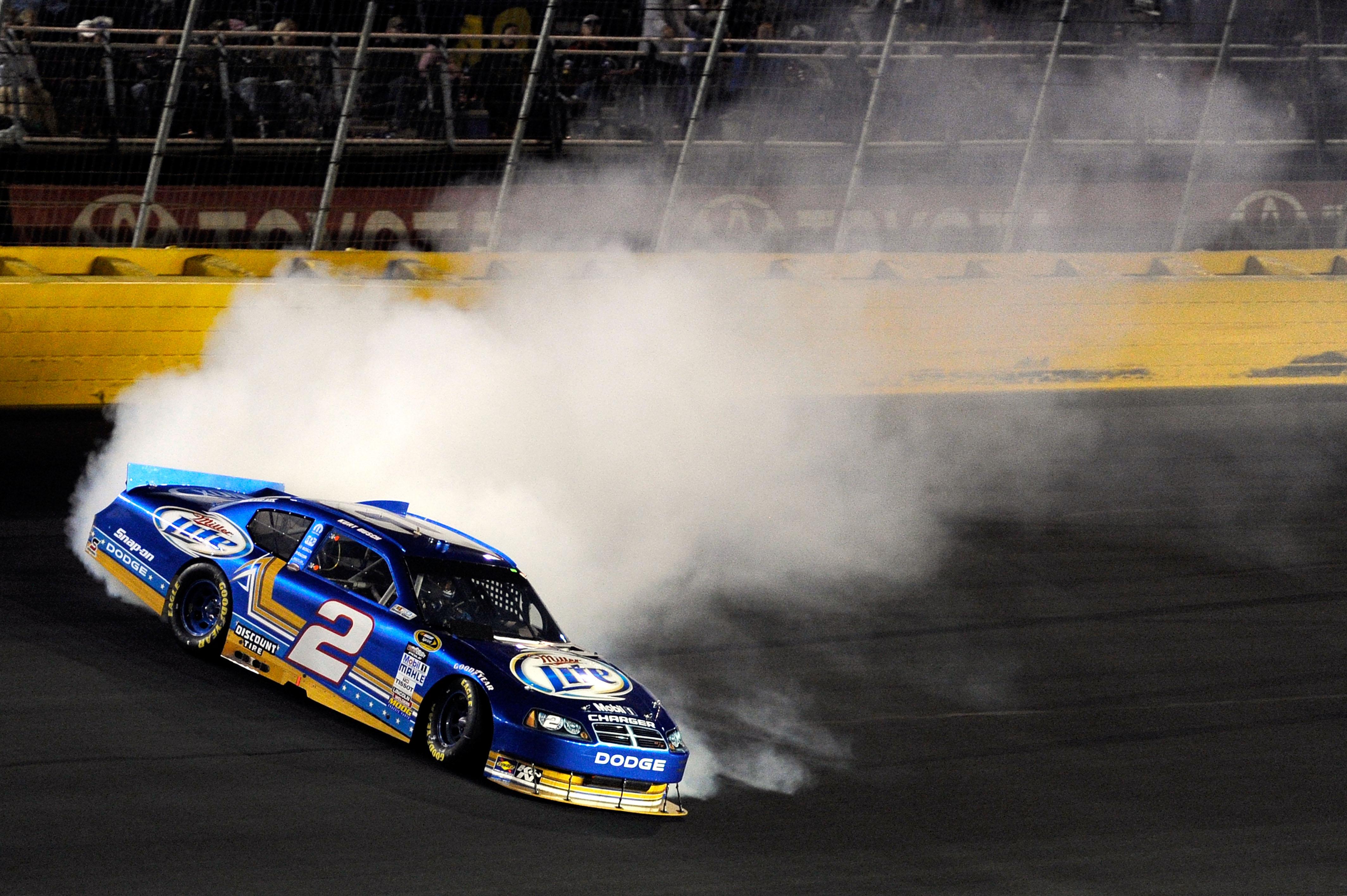 CONCORD, NC - OCTOBER 16:  Kurt Busch, driver of the #2 Operation Home Front/Miller Lite Dodge, spins out after an incident in the NASCAR Sprint Cup Series Bank of America 500 at Charlotte Motor Speedway on October 16, 2010 in Concord, North Carolina.  (P