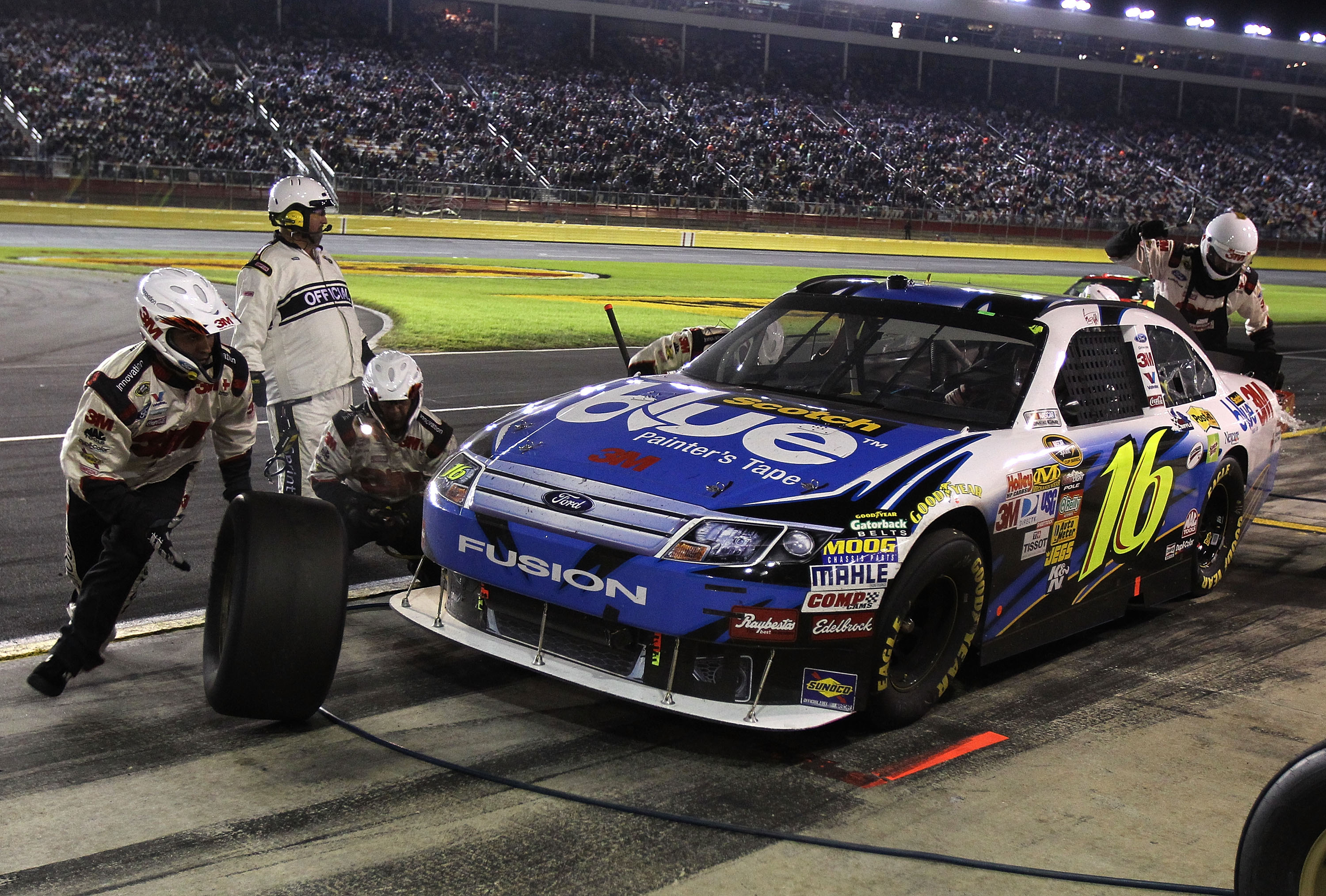 CONCORD, NC - OCTOBER 16:  Greg Biffle, driver of the #16 Scotch Blue Ford, pits during the NASCAR Sprint Cup Series Bank of America 500 at Charlotte Motor Speedway on October 16, 2010 in Concord, North Carolina.  (Photo by Tom Whitmore/Getty Images for N