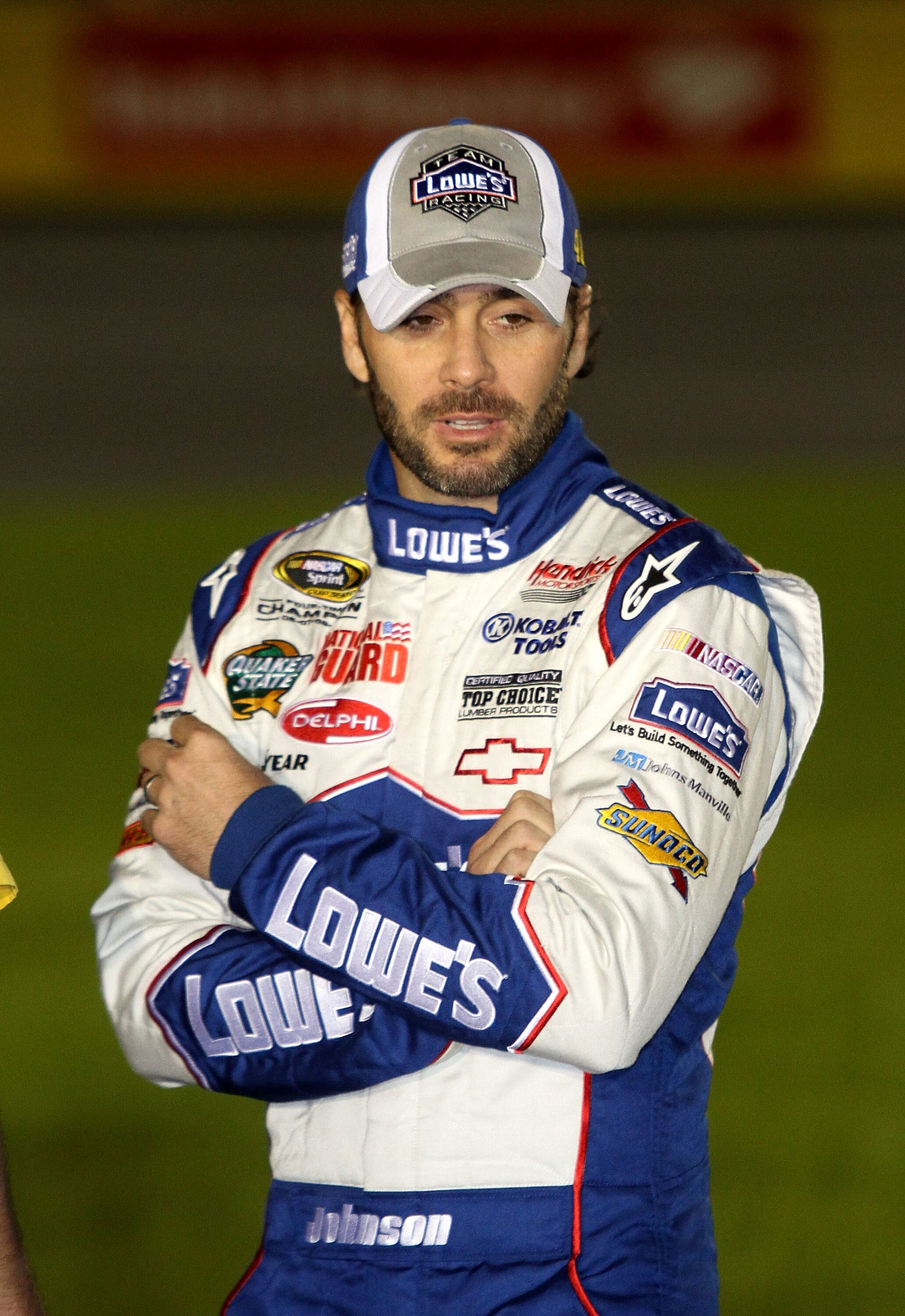 CONCORD, NC - OCTOBER 14:  Jimmie Johnson, driver of the #48 Lowe's Chevrolet, stands on the grid during qualifying for the NASCAR Sprint Cup Series Bank of America 500 at Charlotte Motor Speedway on October 14, 2010 in Concord, North Carolina.  (Photo by