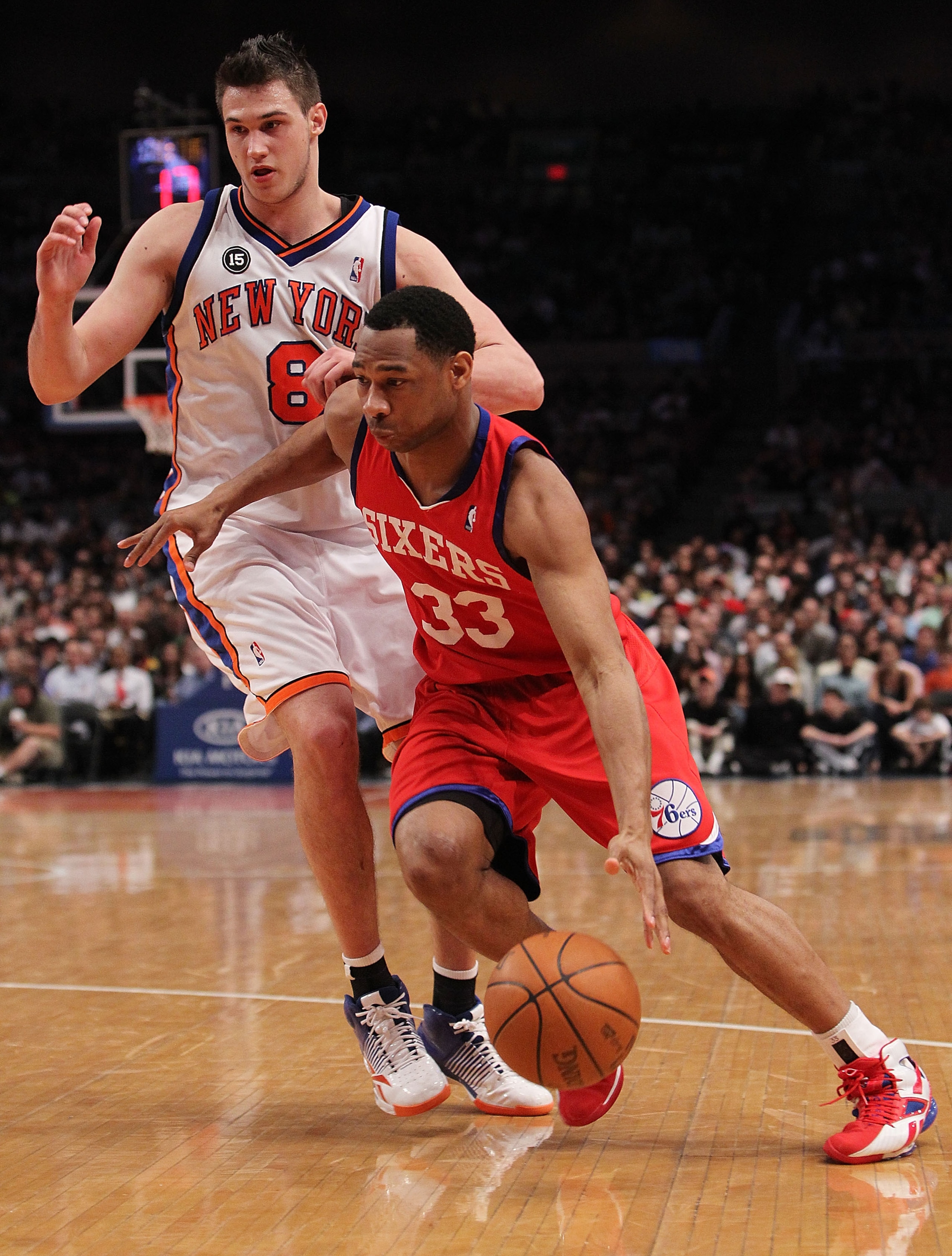 NEW YORK - MARCH 19:  Willie Green #33 of the Philadelphia 76ers drives to the basket against Danilo Gallinari #8 of the New York Knicks at Madison Square Garden on March 19, 2010 in New York City. NOTE TO USER: User expressly acknowledges and agrees that