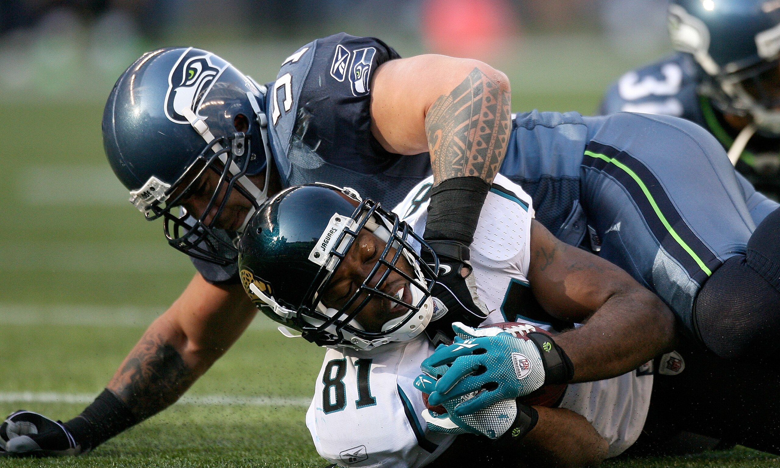 SEATTLE - OCTOBER 11: Wide receiver Torry Holt #81 of the Jacksonville Jaguars is tackled by Lofa Tatupu #51 of the Seattle Seahawks on October 11, 2009 at Qwest Field in Seattle, Washington. The Seahawks defeated the Jaguars 41-0. (Photo by Otto Greule SEATTLE - OCTOBER 11: Wide receiver Torry Holt #81 of the Jacksonville Jaguars is tackled by Lofa Tatupu #51 of the Seattle Seahawks on October 11, 2009 at Qwest Field in Seattle, Washington. The Seahawks defeated the Jaguars 41-0. (Photo by Otto Greule