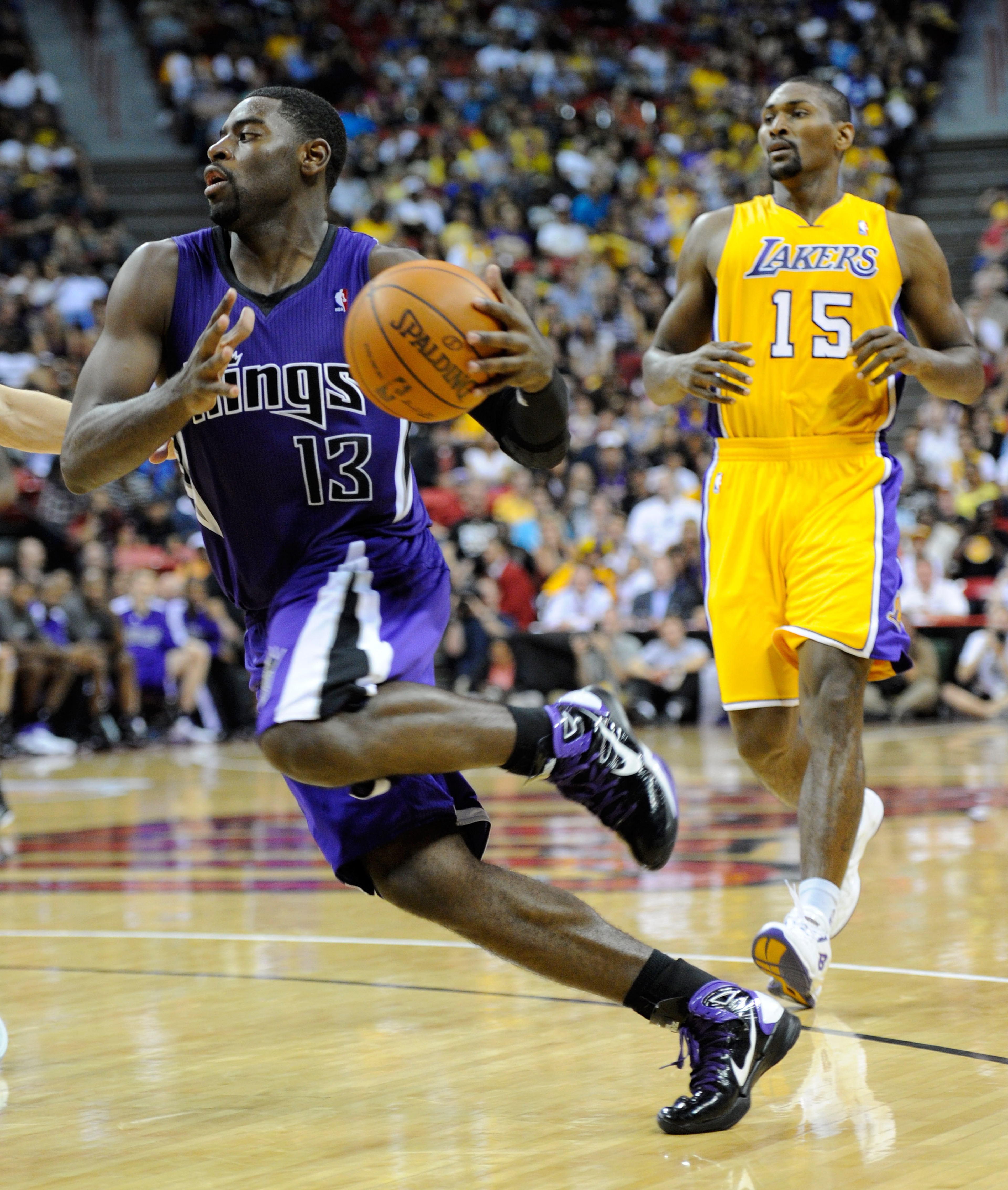 LAS VEGAS - OCTOBER 13: Tyreke Evans #13 of the Sacramento Kings drives ahead of Ron Artest #15 of the Los Angeles Lakers during their preseason game at the Thomas & Mack Center October 13, 2010 in Las Vegas, Nevada. The Lakers won 98-95. NOTE TO USER: U LAS VEGAS - OCTOBER 13: Tyreke Evans #13 of the Sacramento Kings drives ahead of Ron Artest #15 of the Los Angeles Lakers during their preseason game at the Thomas & Mack Center October 13, 2010 in Las Vegas, Nevada. The Lakers won 98-95. NOTE TO USER: U