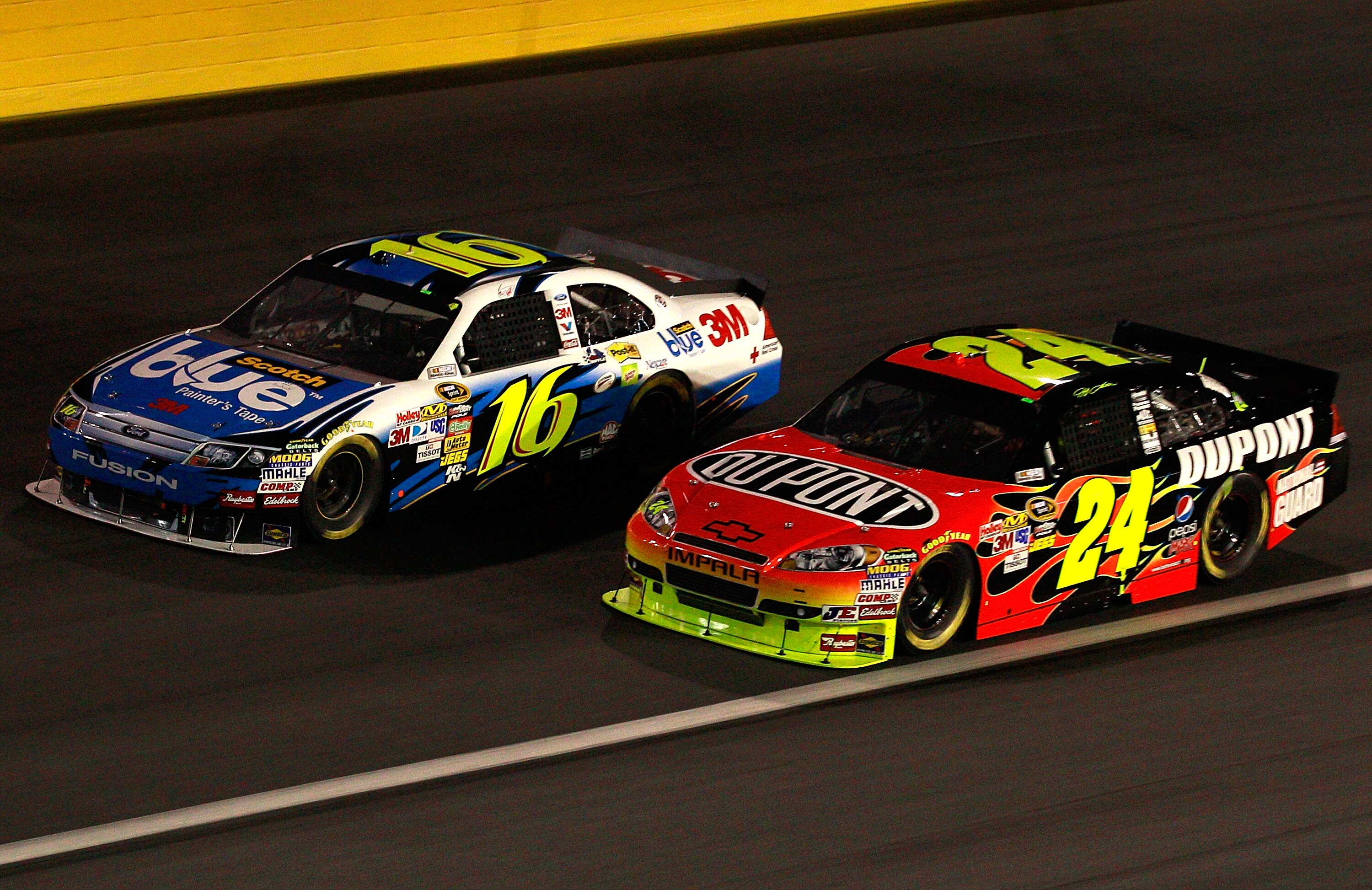 CONCORD, NC - OCTOBER 16:  Greg Biffle, driver of the #16 Scotch Blue Ford, races Jeff Gordon, driver of the #24 DuPont Chevrolet, during the NASCAR Sprint Cup Series Bank of America 500 at Charlotte Motor Speedway on October 16, 2010 in Concord, North Ca