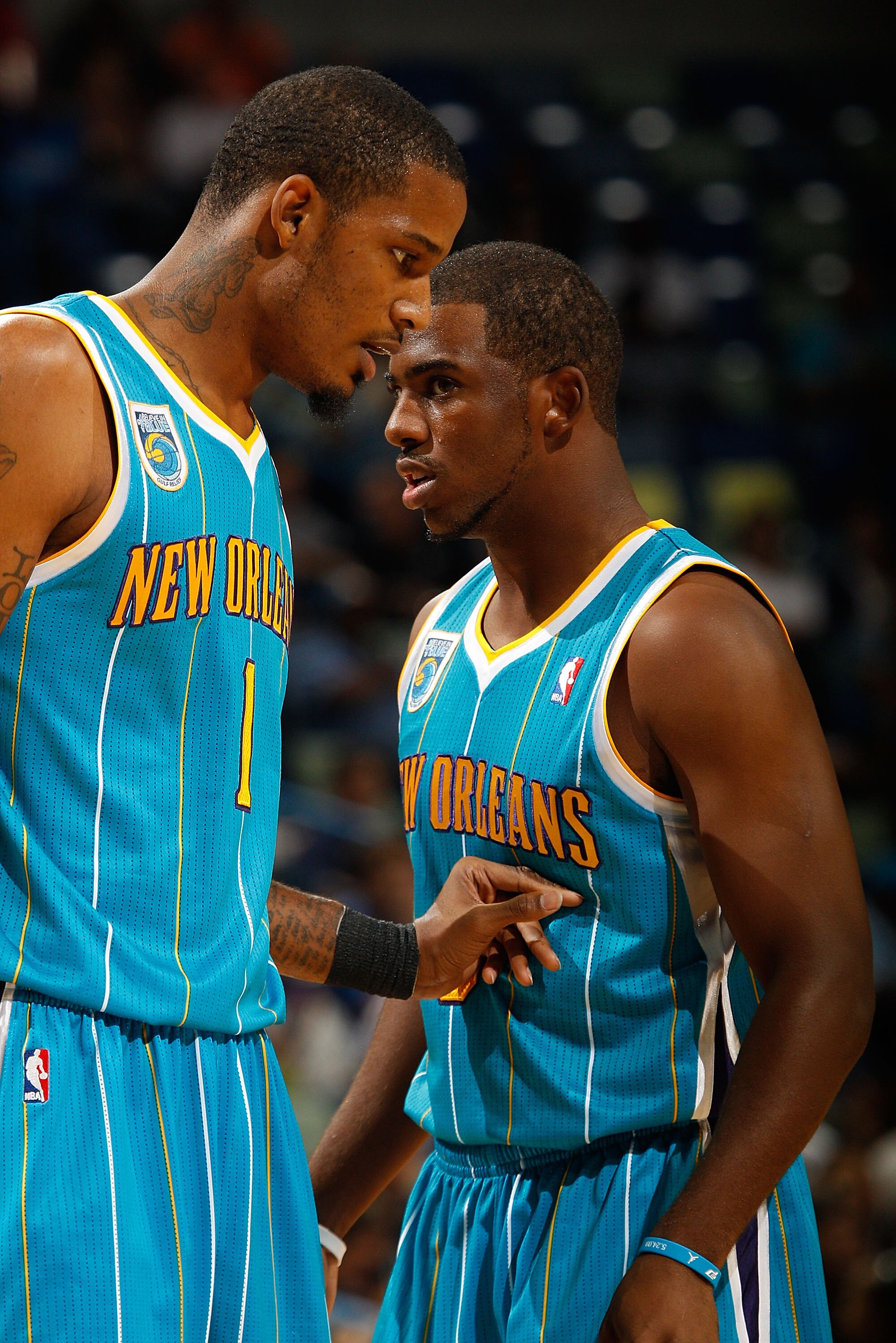 NEW ORLEANS - OCTOBER 13:  Trevor Ariza #1 and Chris Paul #3 of the New Orleans Hornets in action during the game against the Miami Heat at the New Orleans Arena on October 13, 2010 in New Orleans, Louisiana.  NOTE TO USER: User expressly acknowledges and