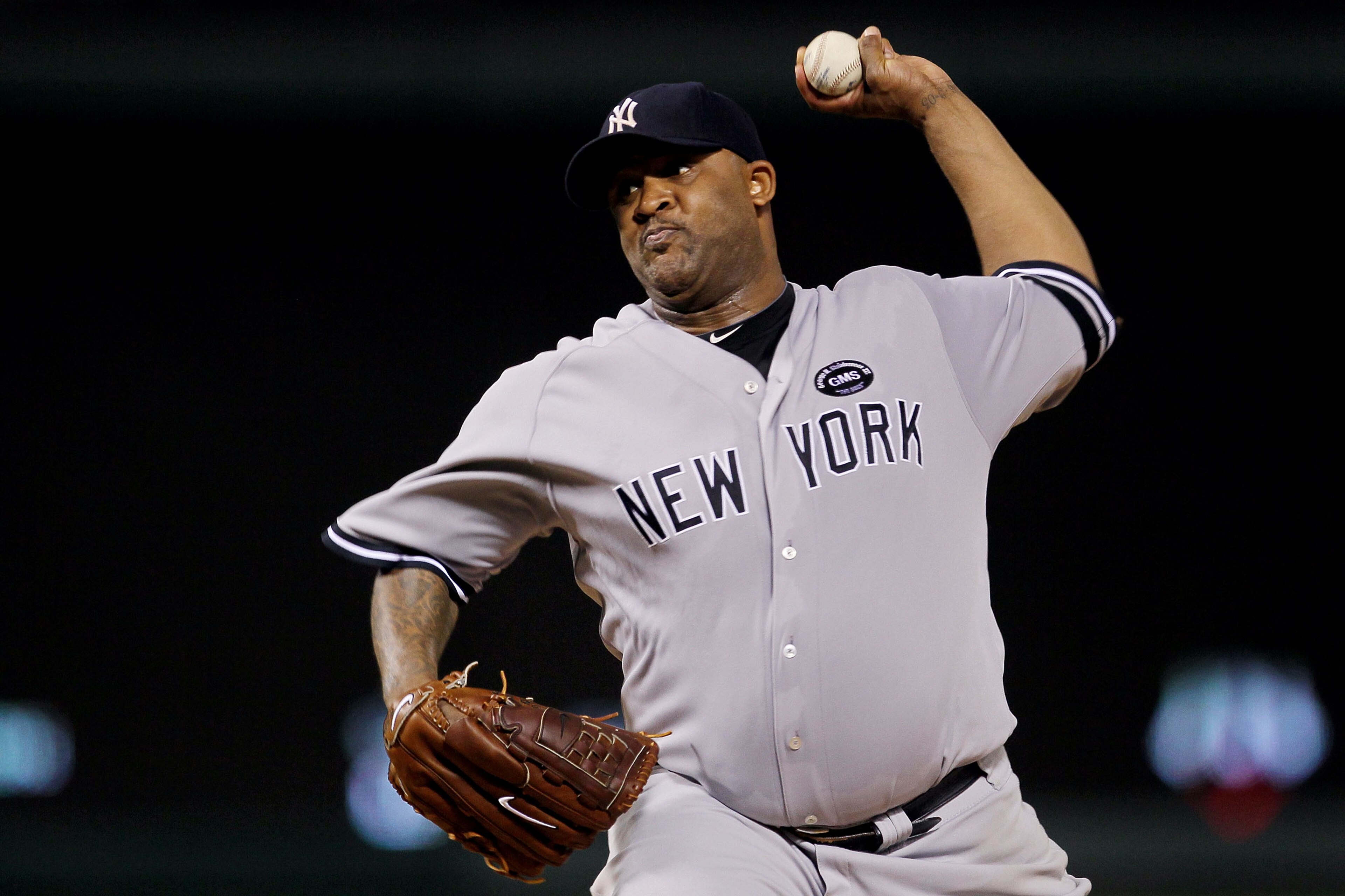 ARLINGTON, TX - OCTOBER 15:  CC Sabithia #52 of the New York Yankees throws a pitch against the Texas Rangers in Game One of the ALCS during the 2010 MLB Playoffs at Rangers Ballpark in Arlington on October 15, 2010 in Arlington, Texas. The Yankees won 6-