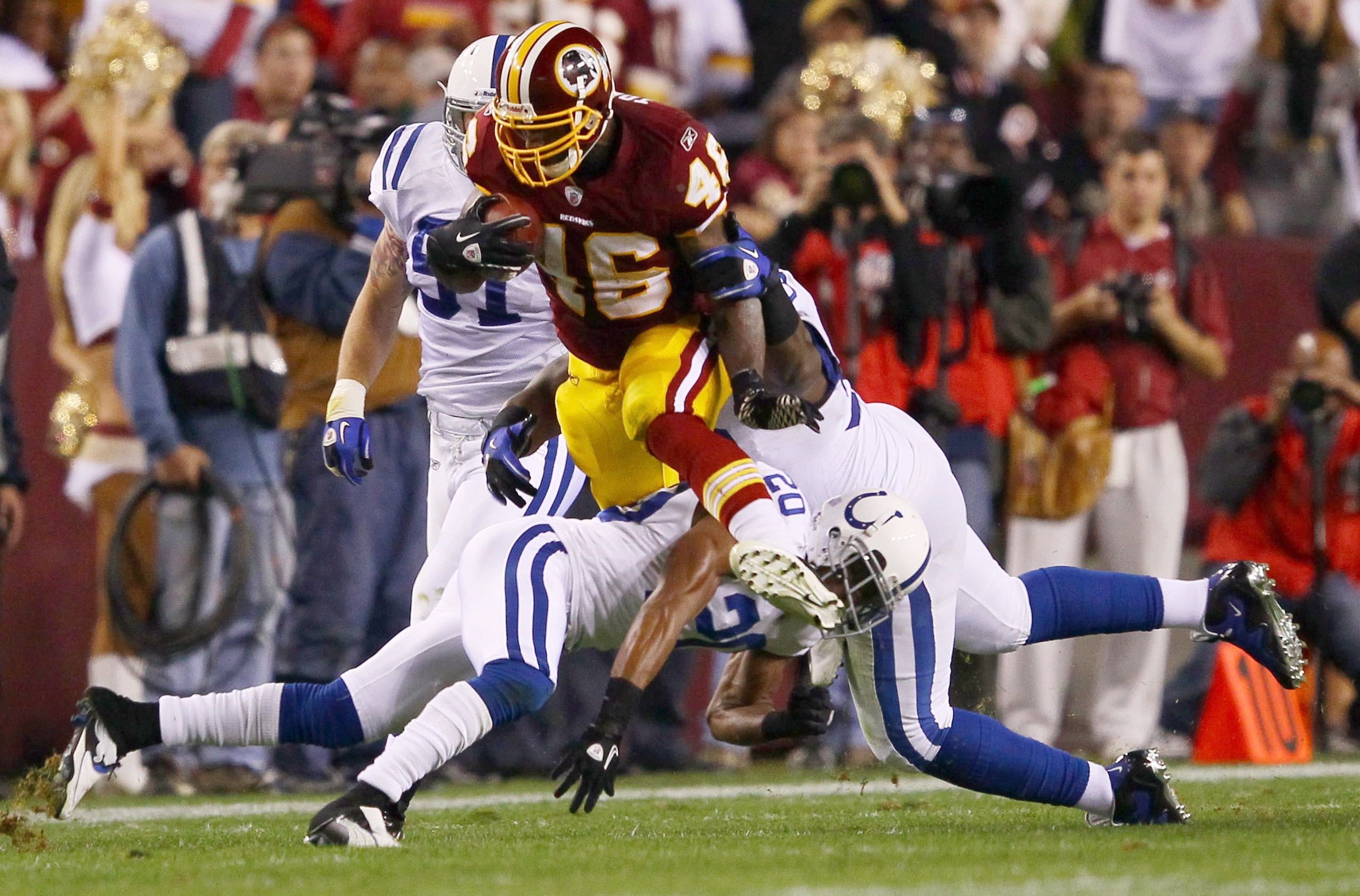 LANDOVER, MD - OCTOBER 17:  Running back Ryan Torain #46 of the Washington Redskins is gang tackled by the Indianapolis Colts defense at FedExField on October 17, 2010 in Landover, Maryland.  (Photo by Win McNamee/Getty Images)