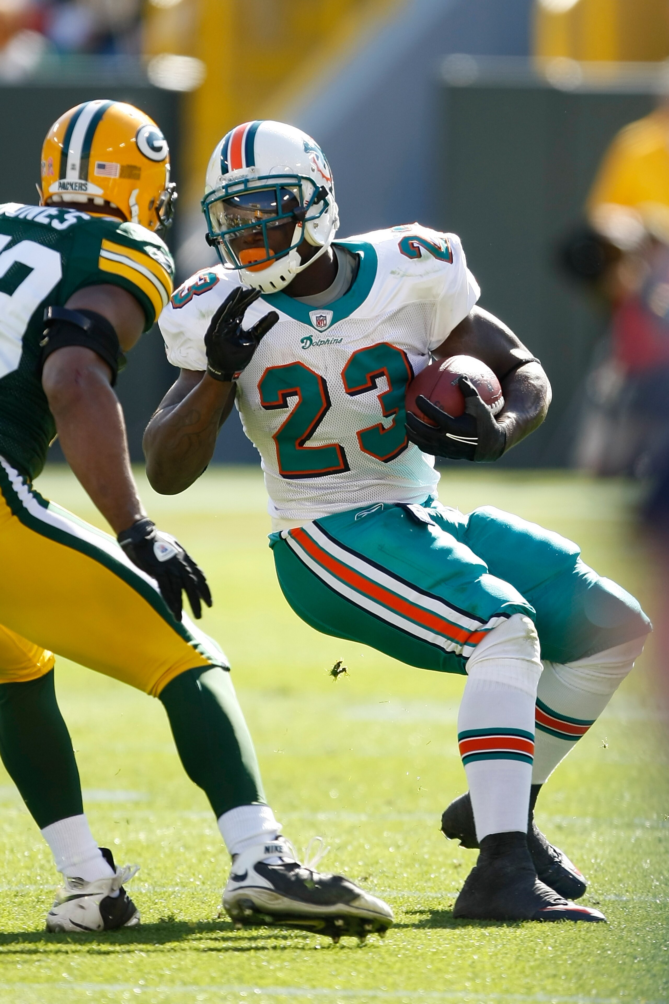 GREEN BAY, WI - OCTOBER 17: Ronnie Brown #23 of the Miami Dolphins runs against the Green Bay Packers at Lambeau Field on October 17, 2010 in Green Bay, Wisconsin. (Photo by Scott Boehm/Getty Images)