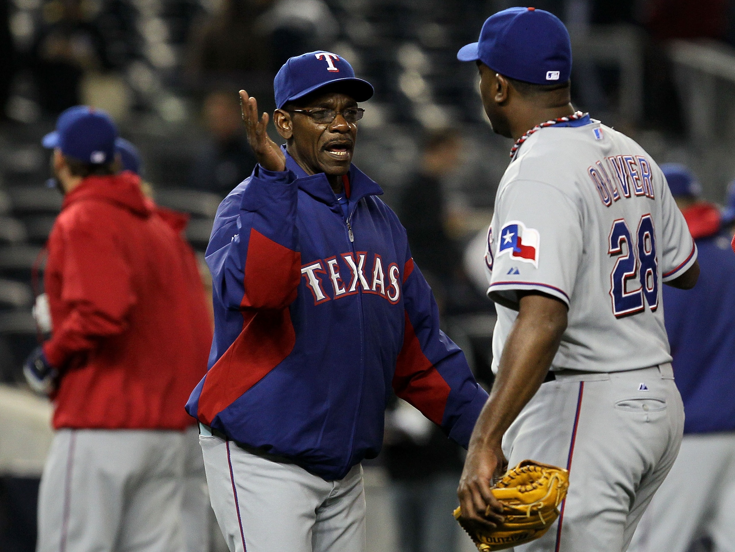 NEW YORK - OCTOBER 19:  (L-R) Manager Ron Washington and Darren Oliver #28 of the Texas Rangers celebrate after the Rangers won 10-3 against the New York Yankees  in Game Four of the ALCS during the 2010 MLB Playoffs at Yankee Stadium on October 19, 2010