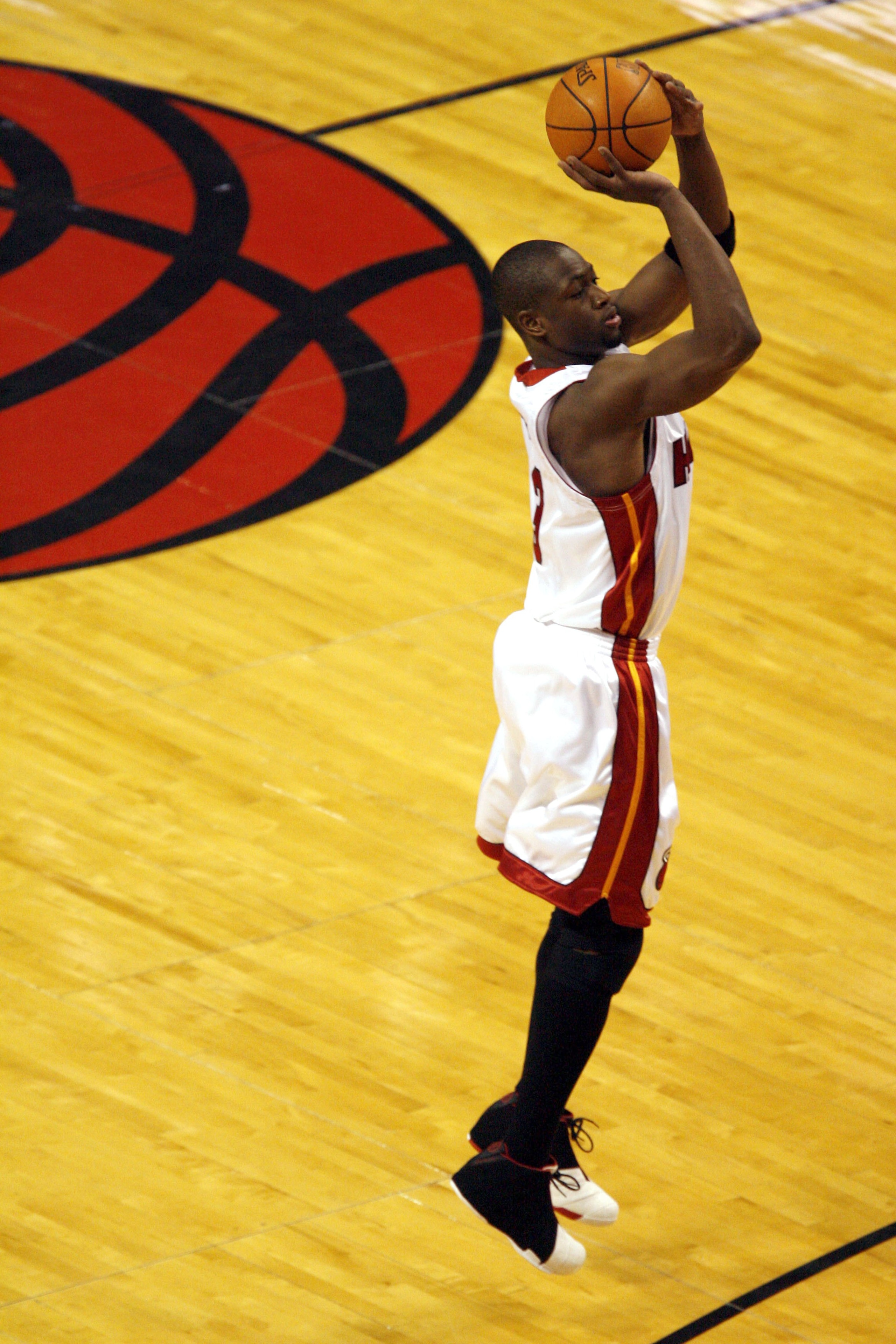 MIAMI - MAY 10:  Dwyane Wade #3 of the Miami Heat shoots a three pointer against the New Jersey Nets in game two of the Eastern Conference Semifinals during the 2006 NBA Playoffs on May 10, 2006 at the American Airlines Arena in Miami, Florida.  NOTE TO U