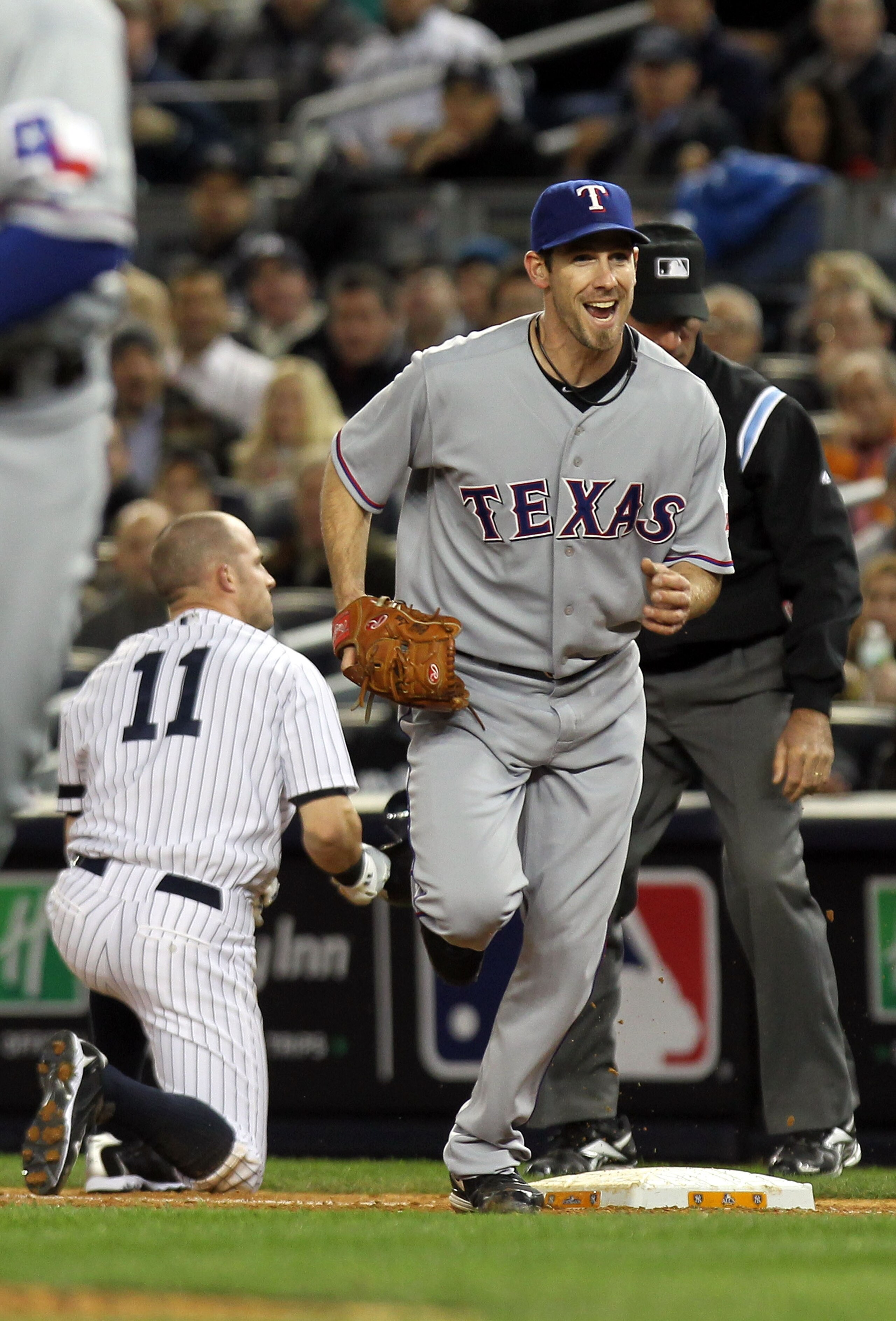 NEW YORK - OCTOBER 18:  Cliff Lee #33 of the Texas Rangers reacts after he forced out Brett Gardner #11 of the New York Yankees at first base in the bottom of the third inning of Game Three of the ALCS during the 2010 MLB Playoffs at Yankee Stadium on Oct