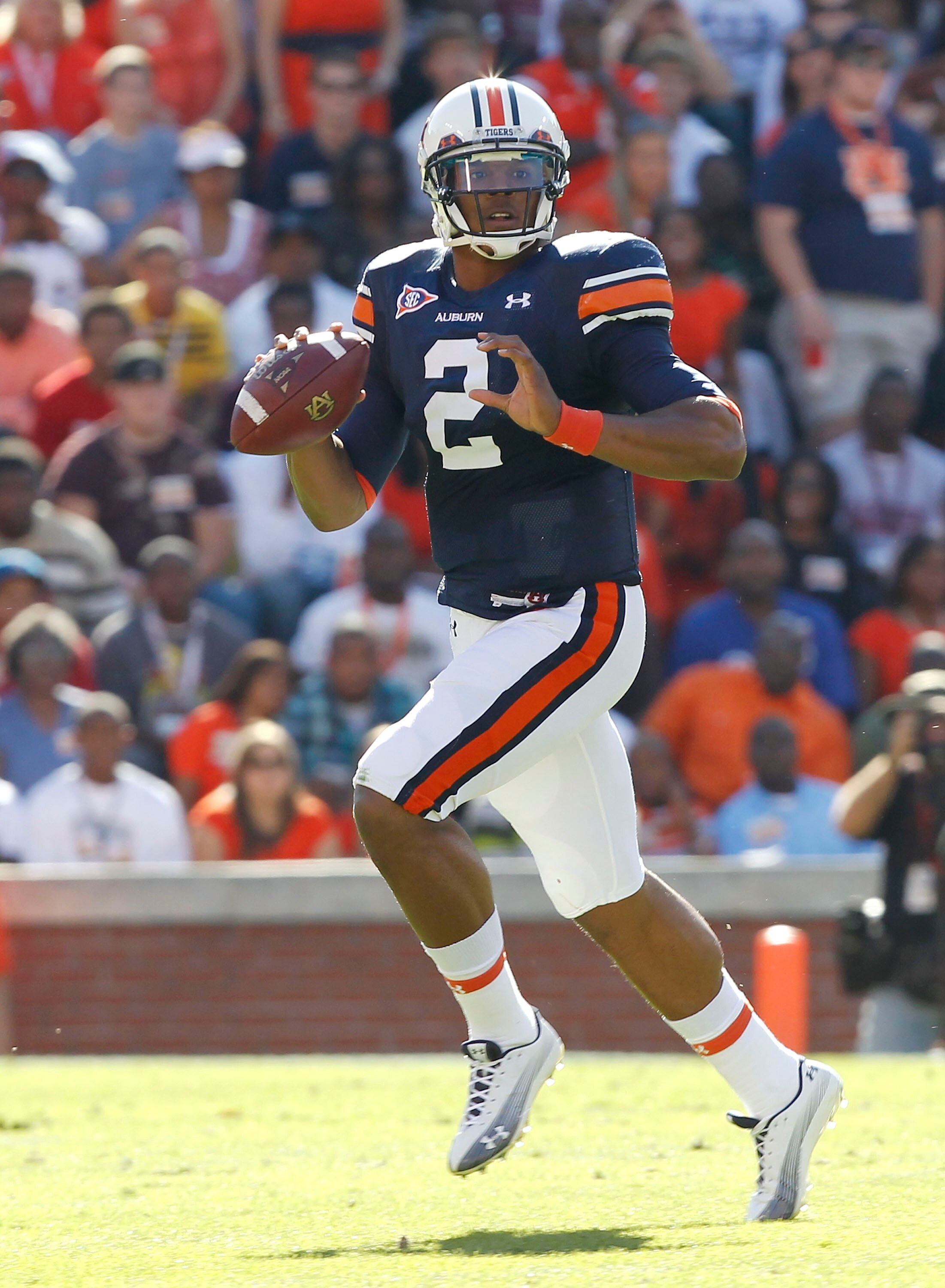 AUBURN, AL - OCTOBER 16:  Quarterback Cam Newton #2 of the Auburn Tigers rolls out and looks downfield for a receiver during the game against the Arkansas Razorbacks at Jordan-Hare Stadium on October 16, 2010 in Auburn, Alabama.  (Photo by Mike Zarrilli/G