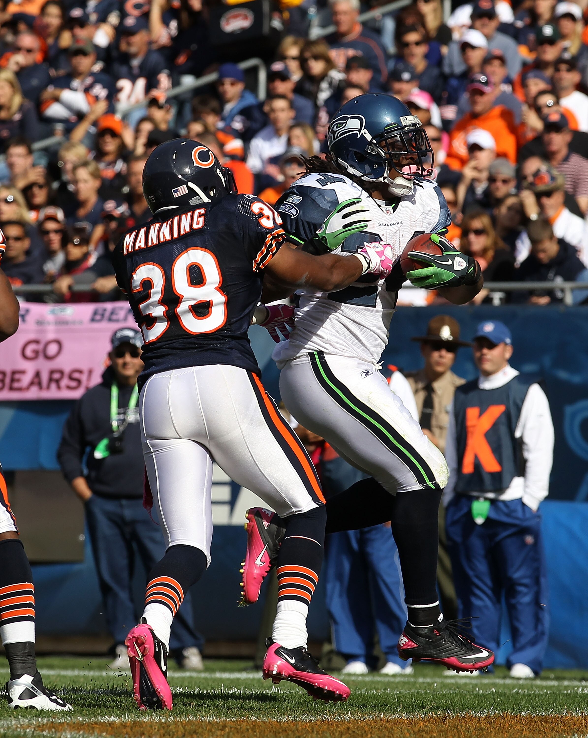 CHICAGO - OCTOBER 17: Marshawn Lynch #24 of the Seattle Seahawks scores a touchdown against Danieal Manning #38 of the Chicago Bears at Soldier Field on October 17, 2010 in Chicago, Illinois. The Seahawks defeated the Bears 23-20. (Photo by Jonathan Danie