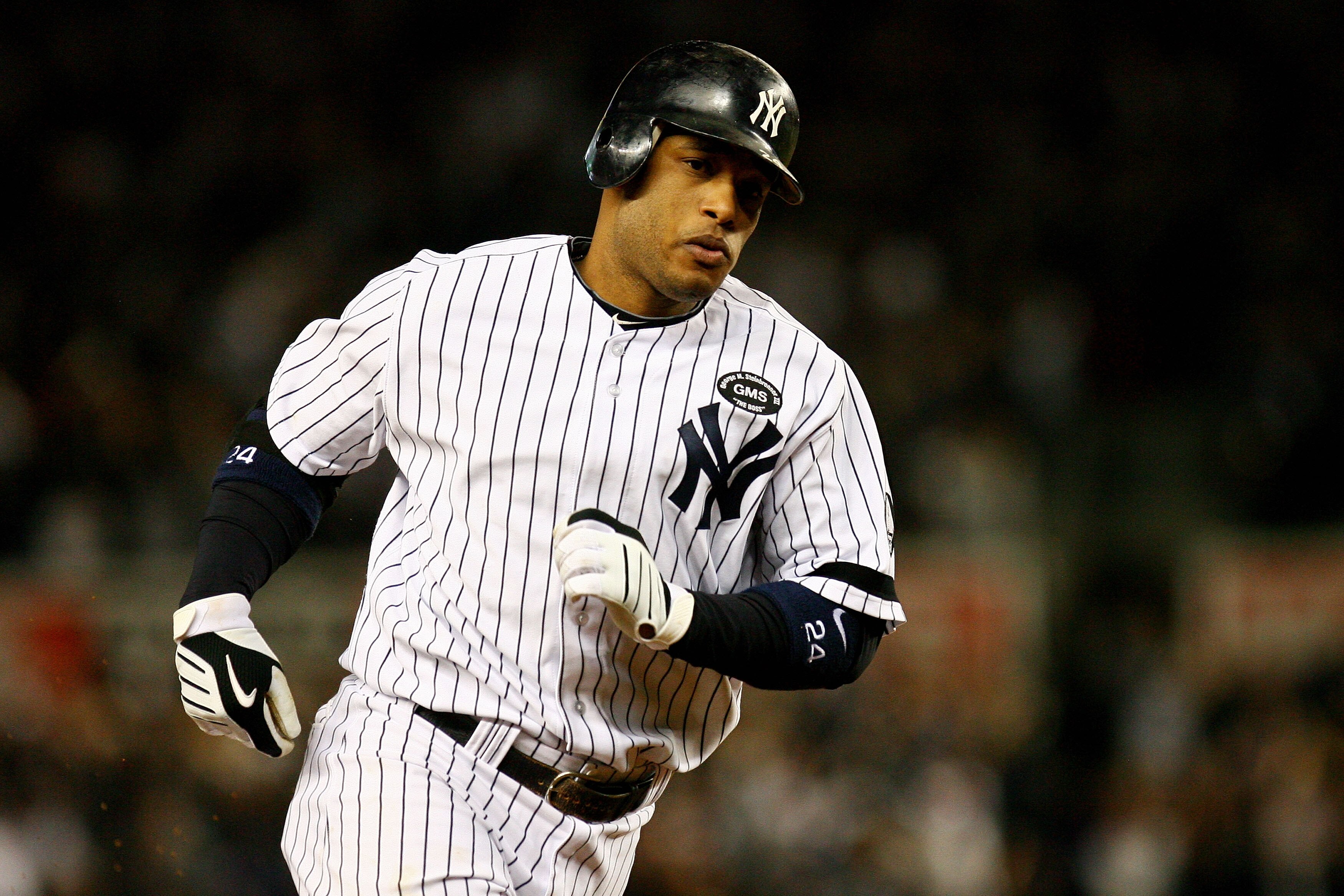 NEW YORK - OCTOBER 19:  Robinson Cano #24 of the New York Yankees round the bases after hitting a solo homerun in the second inning against Tommy Hunter #35 of the Texas Rangers look on in Game Four of the ALCS during the 2010 MLB Playoffs at Yankee Stadi