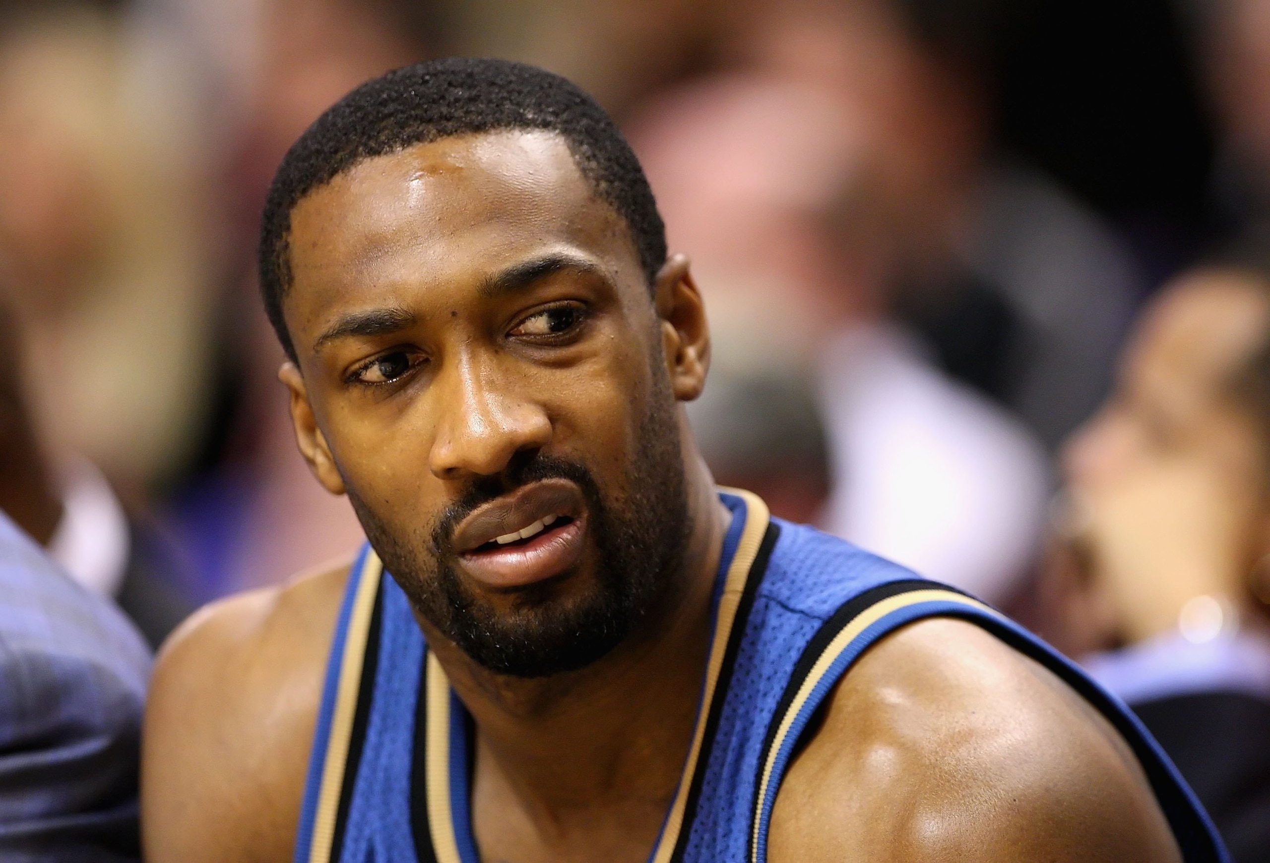 PHOENIX - DECEMBER 19: Gilbert Arenas #0 of the Washington Wizards sits on the bench during the NBA game against the Phoenix Suns at US Airways Center on December 19, 2009 in Phoenix, Arizona. The Suns defeated the Wizards 121-95. NOTE TO USER: User expr PHOENIX - DECEMBER 19: Gilbert Arenas #0 of the Washington Wizards sits on the bench during the NBA game against the Phoenix Suns at US Airways Center on December 19, 2009 in Phoenix, Arizona. The Suns defeated the Wizards 121-95. NOTE TO USER: User expr
