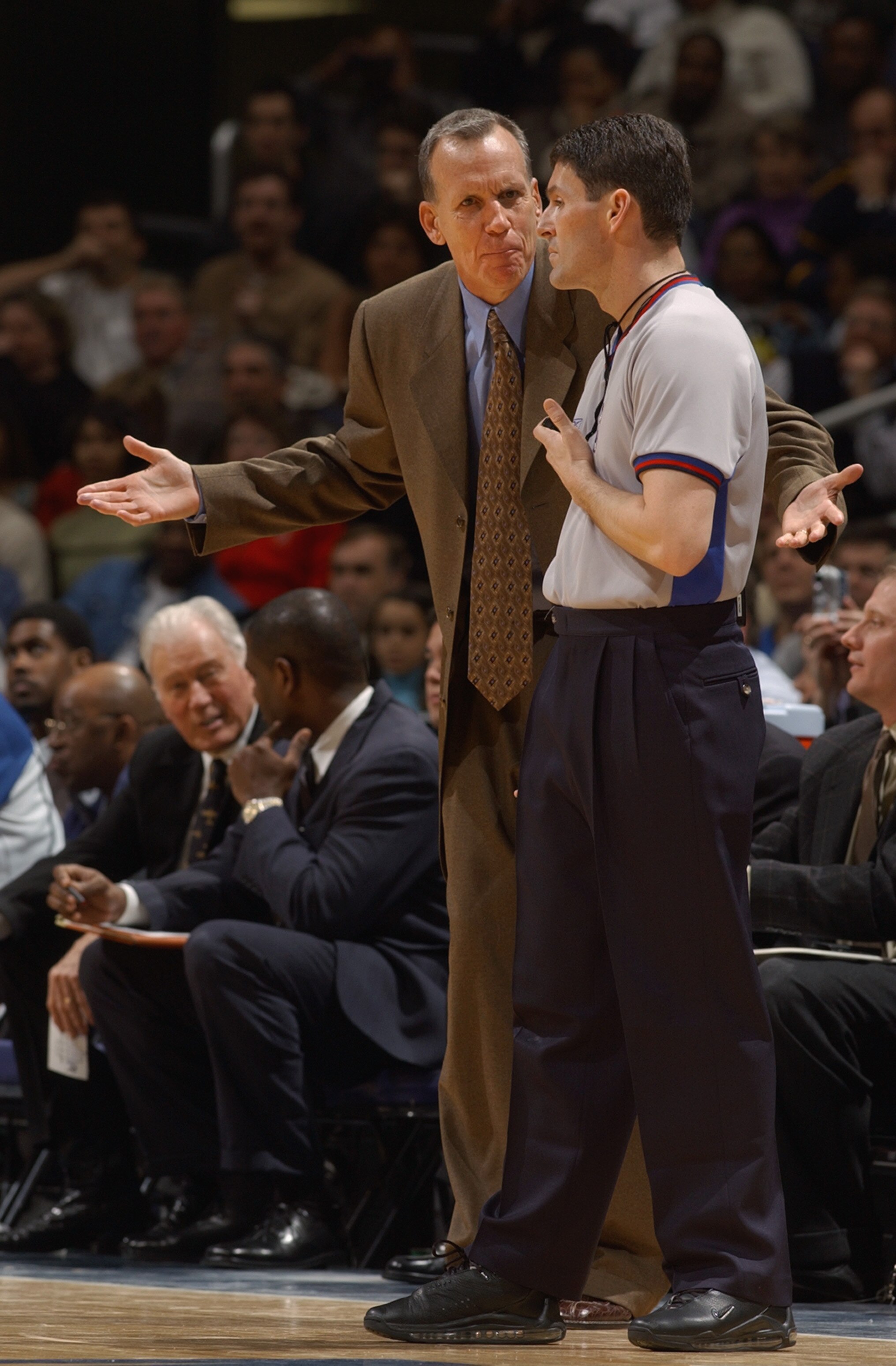 WASHINGTON - FEBRUARY 23:  Head coach Doug Collins of the Washington Wizards reacts to a call by referee Scott Foster #48 during the game at MCI Center on February 23, 2003 in Washington, D.C.  The Mavericks won in overtime 106-101.  NOTE TO USER: User ex