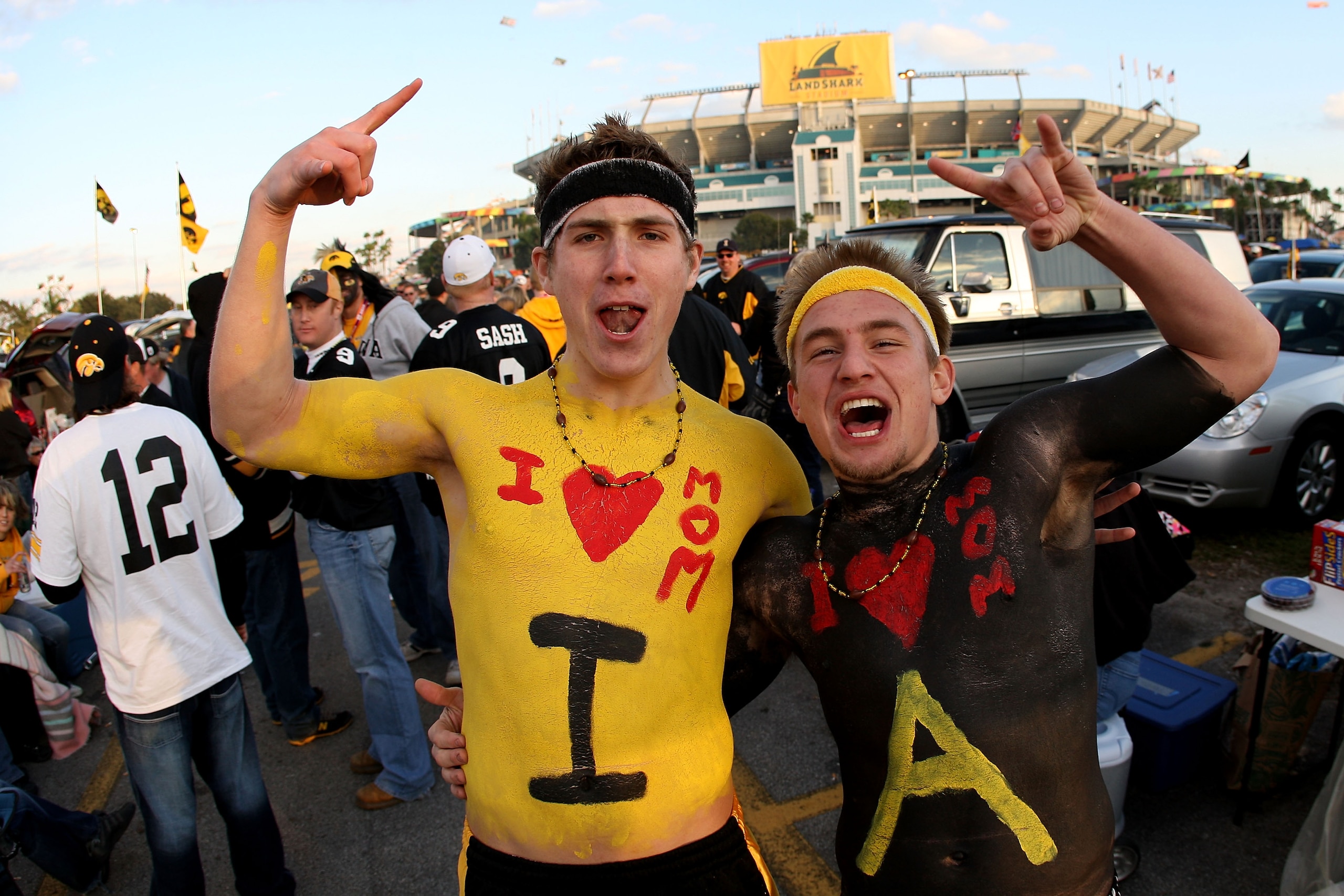 MIAMI GARDENS, FL - JANUARY 05:  (L-R) Kris Hopkins and Aaron Getterlund, fans of the Iowa Hawkeyes show support for their team in the parking lot against the Georgia Tech Yellow Jackets during the FedEx Orange Bowl at Land Shark Stadium on January 5, 201