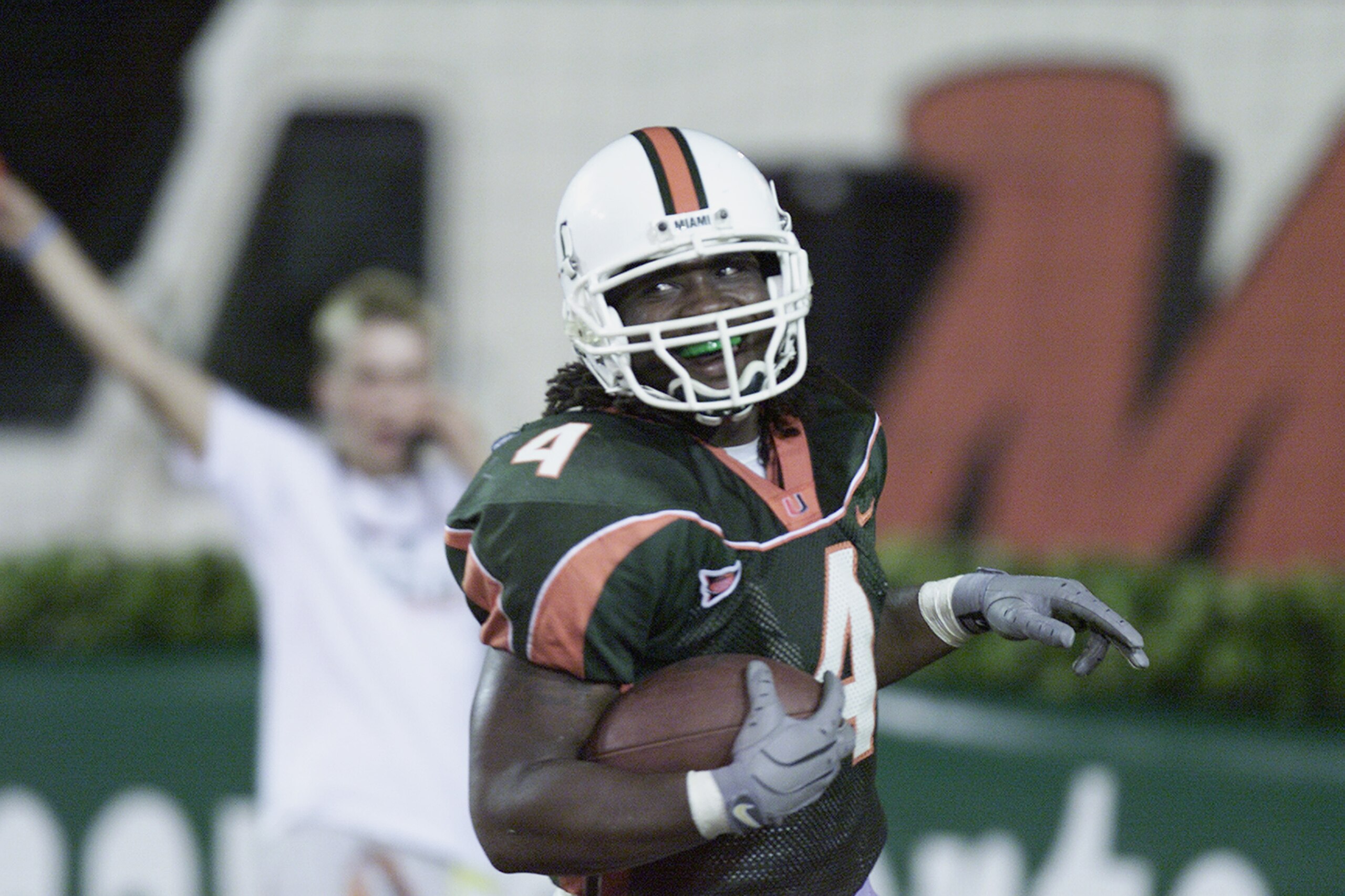 MIAMI - NOVEMBER 17: Running back Najeh Davenport #4 of the Miami Hurricanes scores a touchdown during the Big East Conference football game against the Syracuse Orangemen at the Orange Bowl on November 17, 2001 in Miami Florida. Miami won 59-0. (Photo MIAMI - NOVEMBER 17: Running back Najeh Davenport #4 of the Miami Hurricanes scores a touchdown during the Big East Conference football game against the Syracuse Orangemen at the Orange Bowl on November 17, 2001 in Miami Florida. Miami won 59-0. (Photo