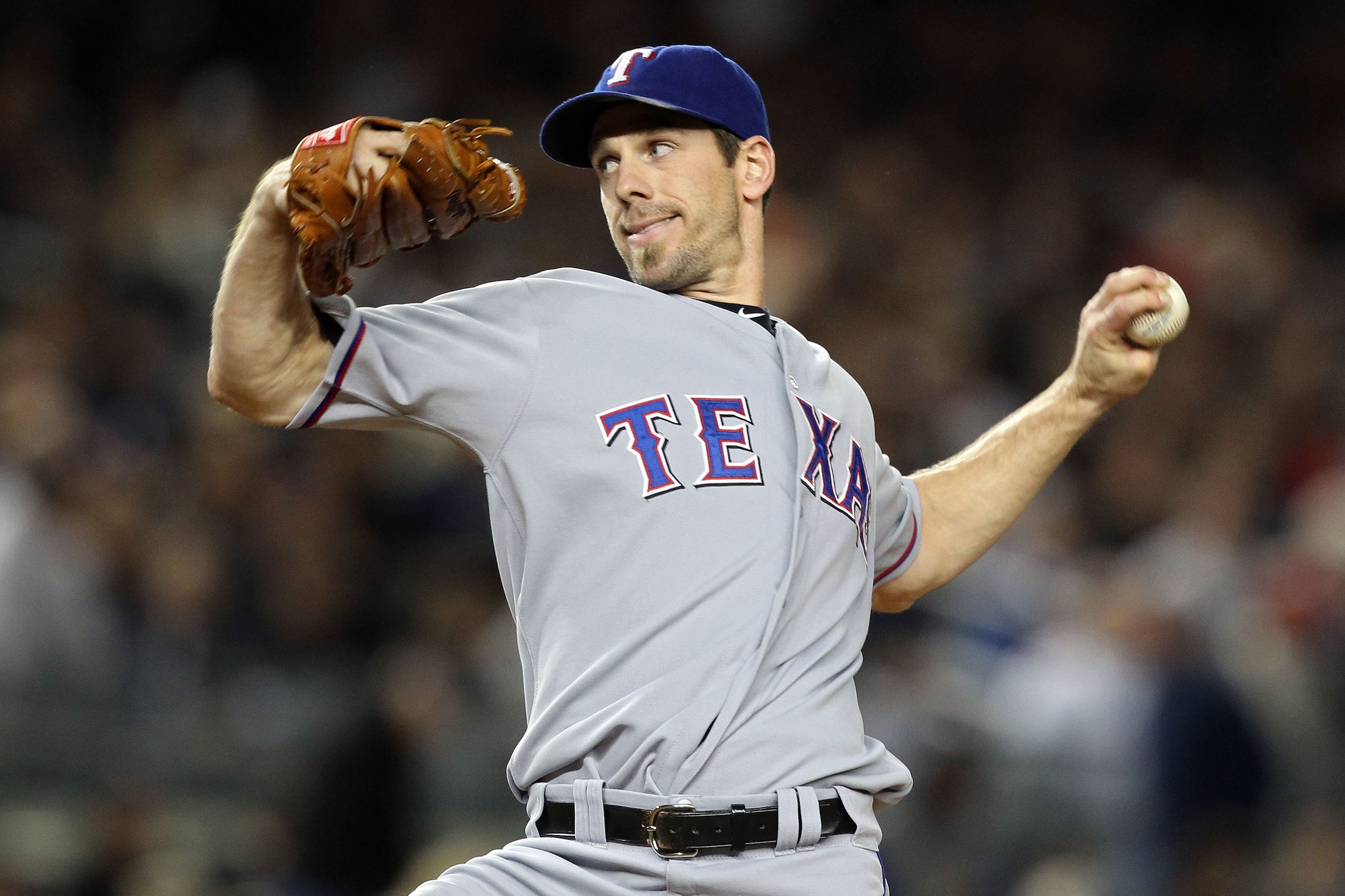 NEW YORK - OCTOBER 18:  Cliff Lee #33 of the Texas Rangers throws a pitch against the New York Yankees in Game Three of the ALCS during the 2010 MLB Playoffs at Yankee Stadium on October 18, 2010 in New York, New York.  (Photo by Al Bello/Getty Images)