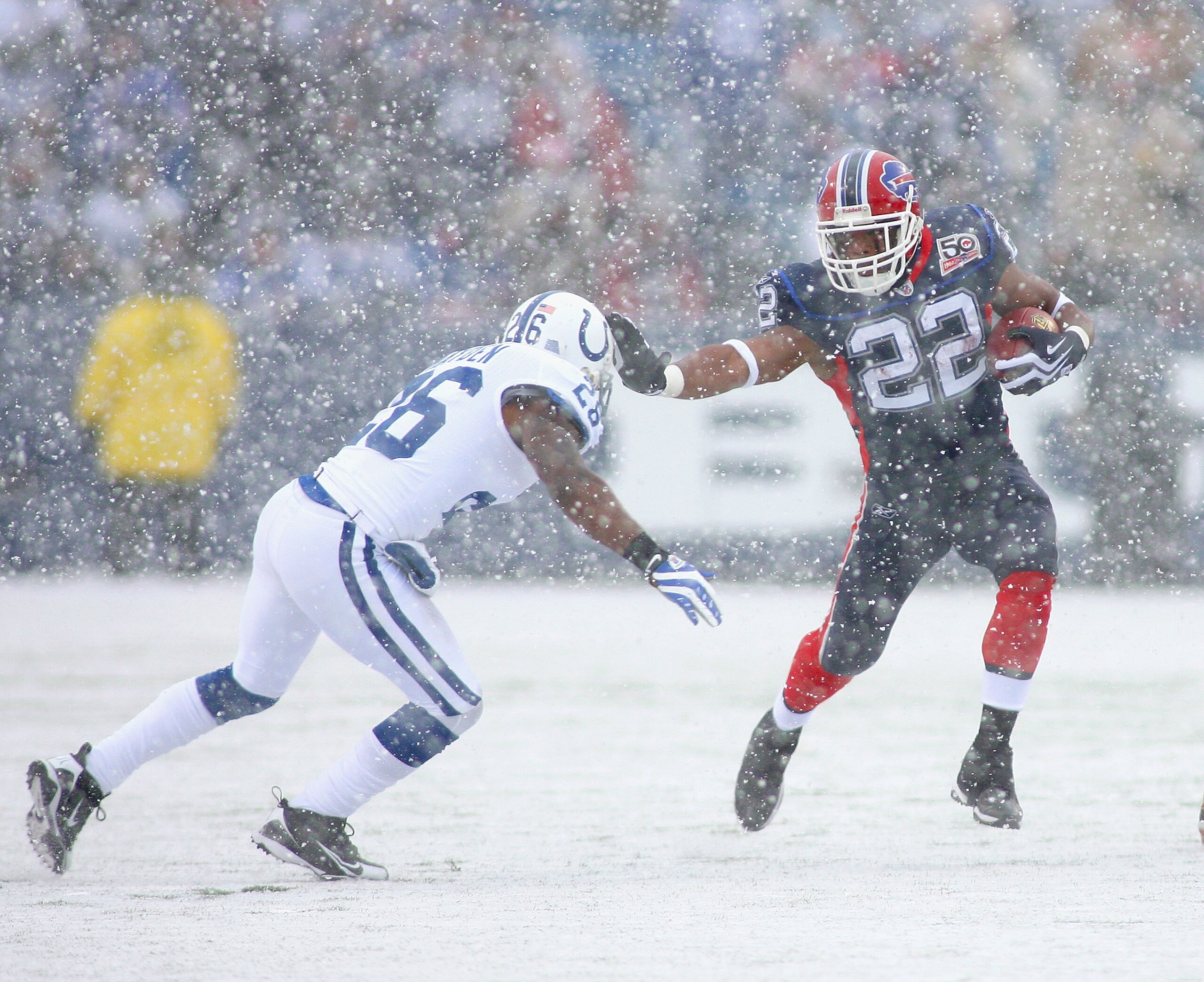 ORCHARD PARK, NY - JANUARY 03: Fred Jackson #22 of the Buffalo Bills stiff-arms Kelvin Hayden #26 of the Indianapolis Colts at Ralph Wilson Stadium on January 3, 2010 in Orchard Park, New York.  (Photo by Rick Stewart/Getty Images)