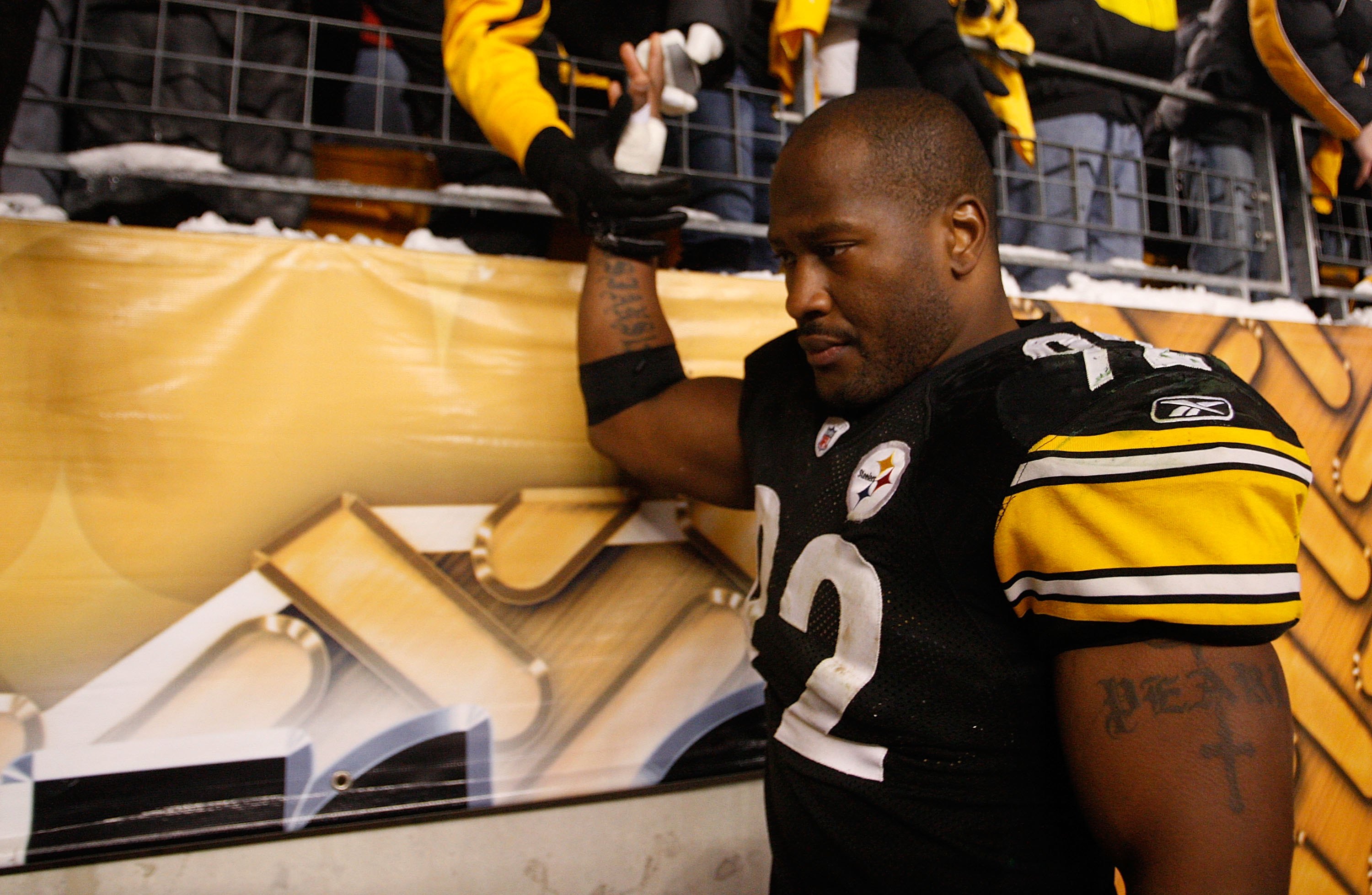 PITTSBURGH - DECEMBER 20:  James Harrison #92 of the Pittsburgh Steelers high fives fans as he walks off the field following the game against the Green Bay Packers on December 20, 2009 at Heinz Field in Pittsburgh, Pennsylvania.  (Photo by Jared Wickerham