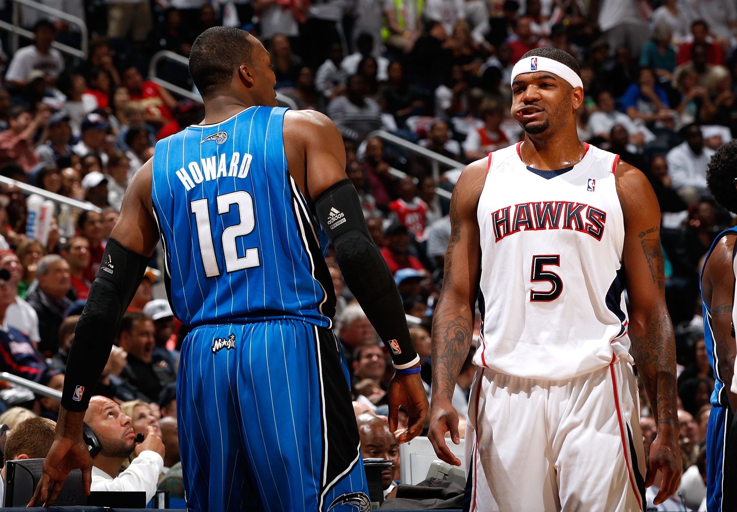 ATLANTA - MAY 10:  Dwight Howard #12 of the Orlando Magic against Josh Smith #5 of the Atlanta Hawks during Game Four of the Eastern Conference Semifinals of the 2010 NBA Playoffs at Philips Arena on May 10, 2010 in Atlanta, Georgia.  NOTE TO USER: User e
