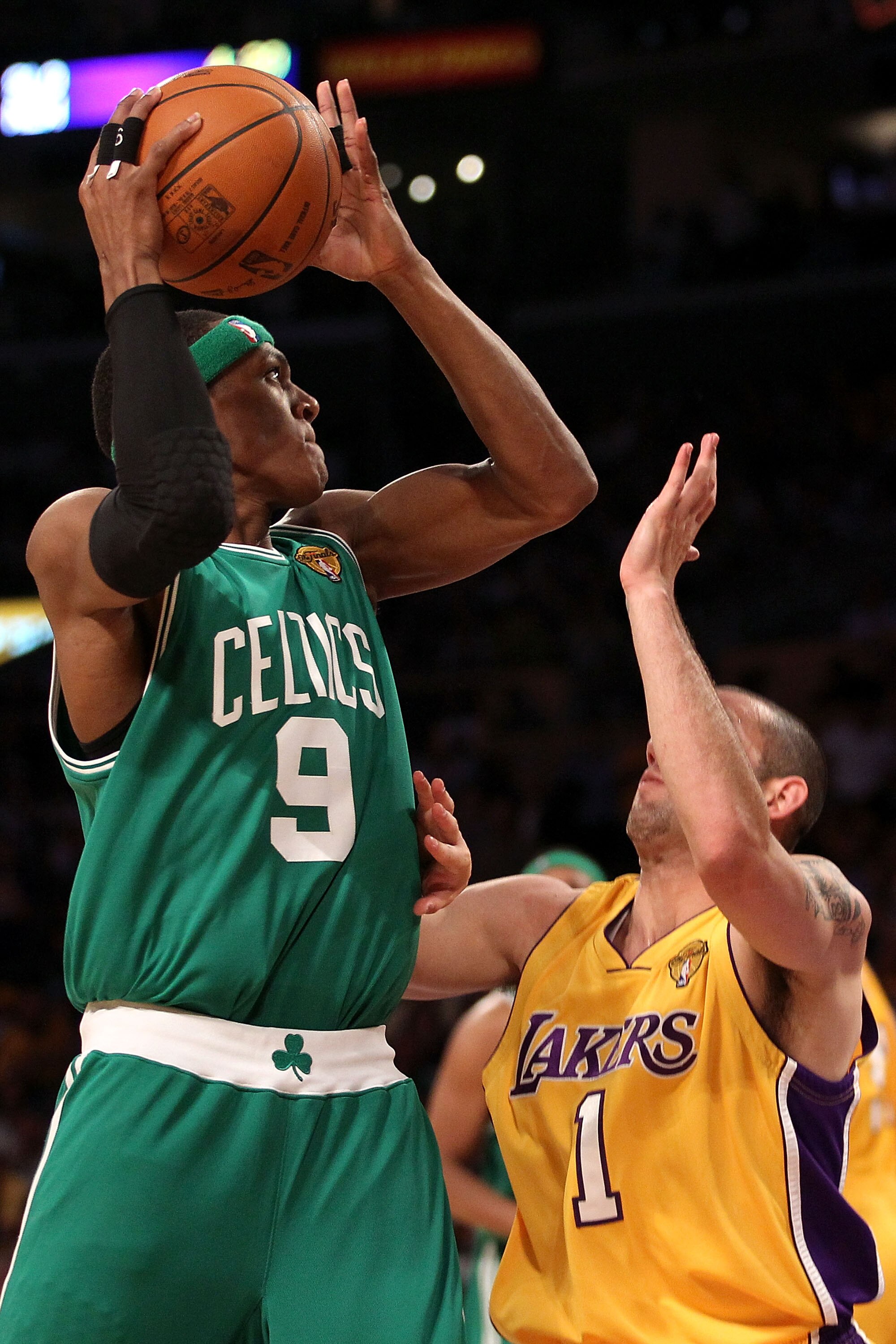 LOS ANGELES, CA - JUNE 15:  Rajon Rondo #9 of the Boston Celtics goes up for a shot over Jordan Farmar #1 of the Los Angeles Lakers in Game Six of the 2010 NBA Finals at Staples Center on June 15, 2010 in Los Angeles, California.  NOTE TO USER: User expre