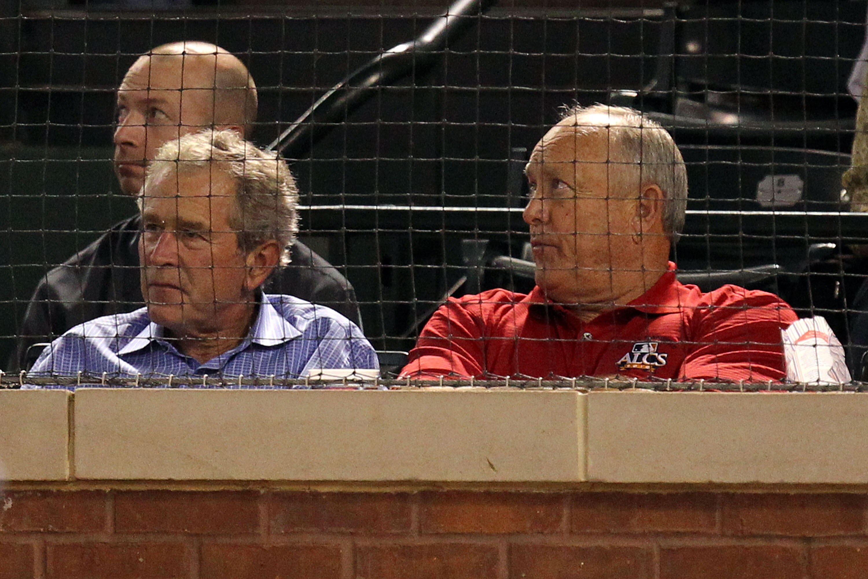ARLINGTON, TX - OCTOBER 15:  (L-R) Former President George W. Bush  and General Manager Nolan Ryan of the Texas Ranger watch the Rangers play against the New York Yankees in Game One of the ALCS during the 2010 MLB Playoffs at Rangers Ballpark in Arlingto