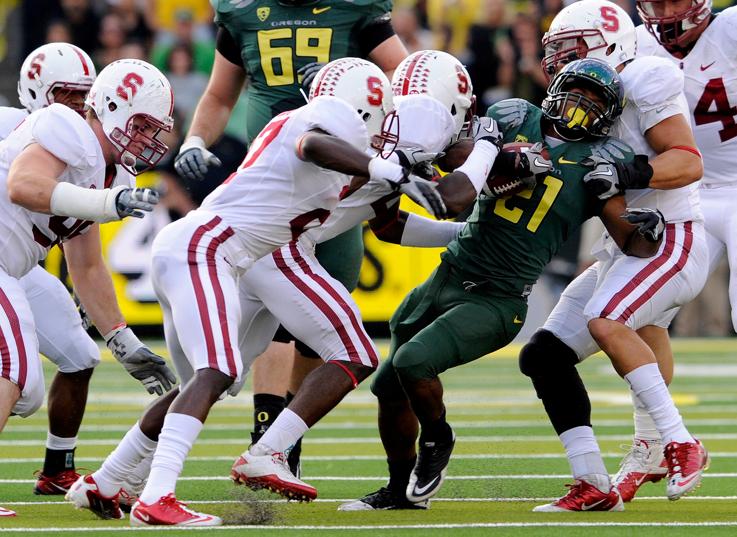 EUGENE, OR - OCTOBER 2: Stanford Cardinal defenders struggle to bring down running back LaMichael James #21 of the Oregon Ducks celebrates as he scores a touchdown in the second quarter of the game against the Stanford Cardinal at Autzen Stadium on Octobe