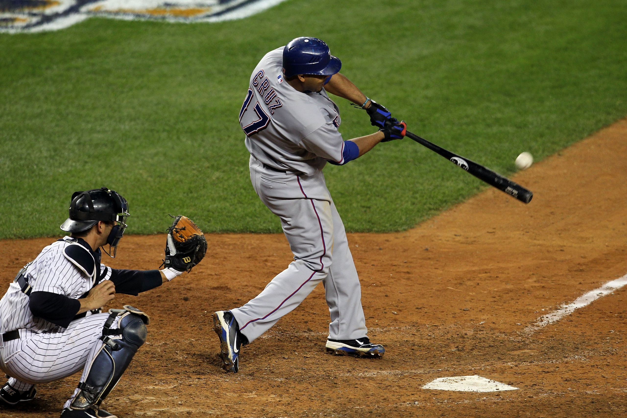 NEW YORK - OCTOBER 19:  Nelson Cruz #17 of the Texas Rangers hits a 2-run home run in the bottom of the ninth inning against the New York Yankees  in Game Four of the ALCS during the 2010 MLB Playoffs at Yankee Stadium on October 19, 2010 in the Bronx bor