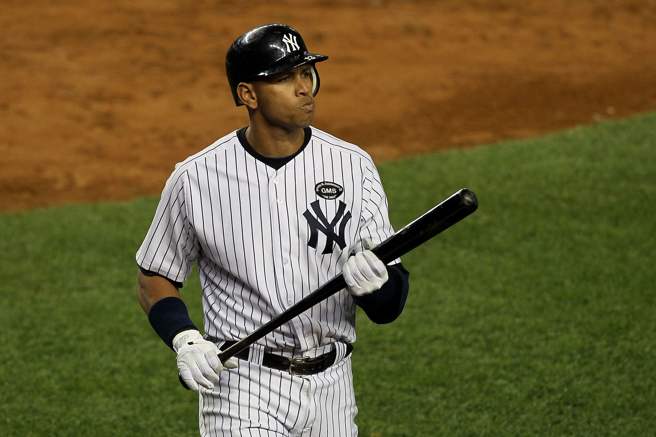 NEW YORK - OCTOBER 18:  Alex Rodriguez #13 of the New York Yankees reacts as he walks back to the dugout after he struck out in the bottom of the seocnd inning against the Texas Rangers in Game Three of the ALCS during the 2010 MLB Playoffs at Yankee Stad