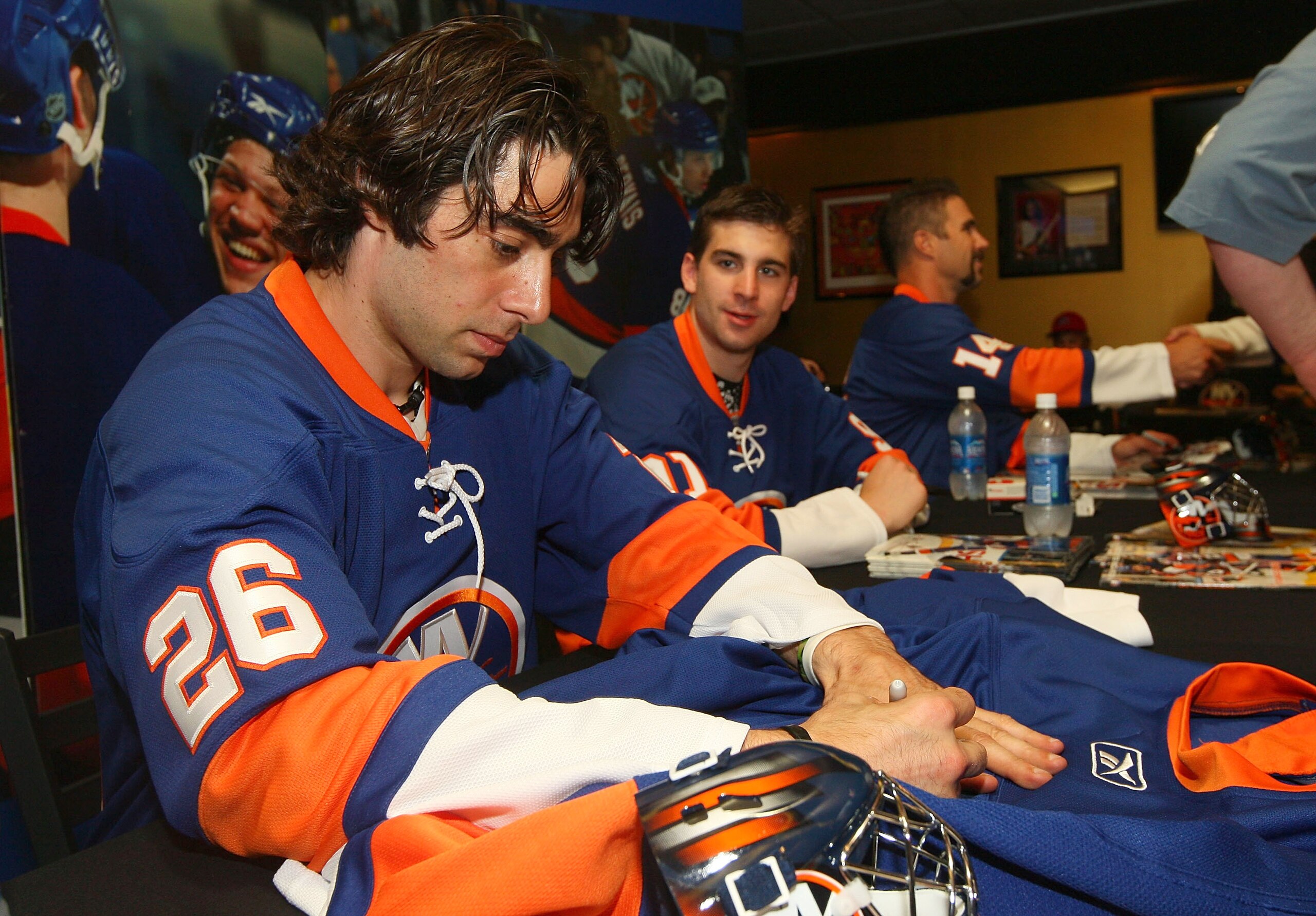 UNIONDALE, NY - JUNE 25: Matt Moulson #26 and John Tavares #91 sign autographs during the New York Islanders Draft Day Party on June 25, 2010 at Nassau Coliseum in Uniondale, New York.  (Photo by Mike Stobe/Getty Images for New York Islanders)