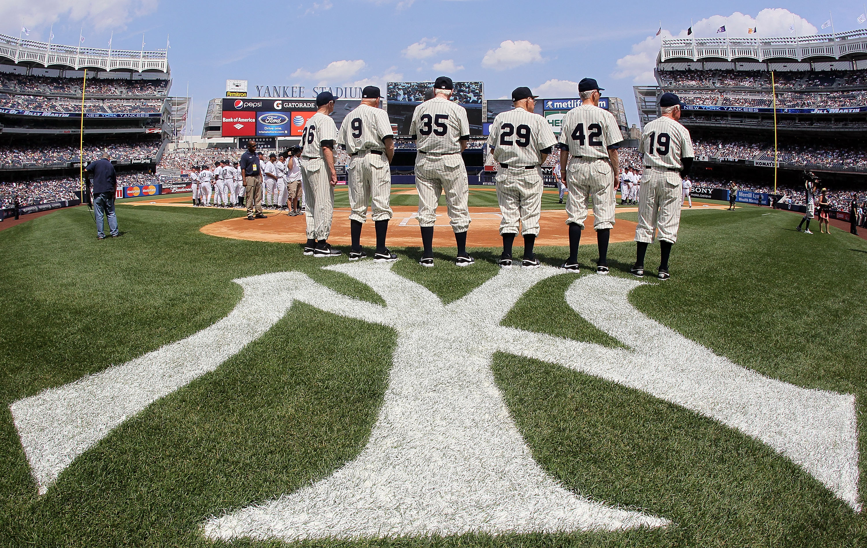 NEW YORK - JULY 17:  Members of the New York Yankees 1950 World Series championship team stand during ceremonies prior to the start of the teams 64th Old-Timer's Day before the MLB game against the Tampa Bay Rays on July 17, 2010 at Yankee Stadium in the