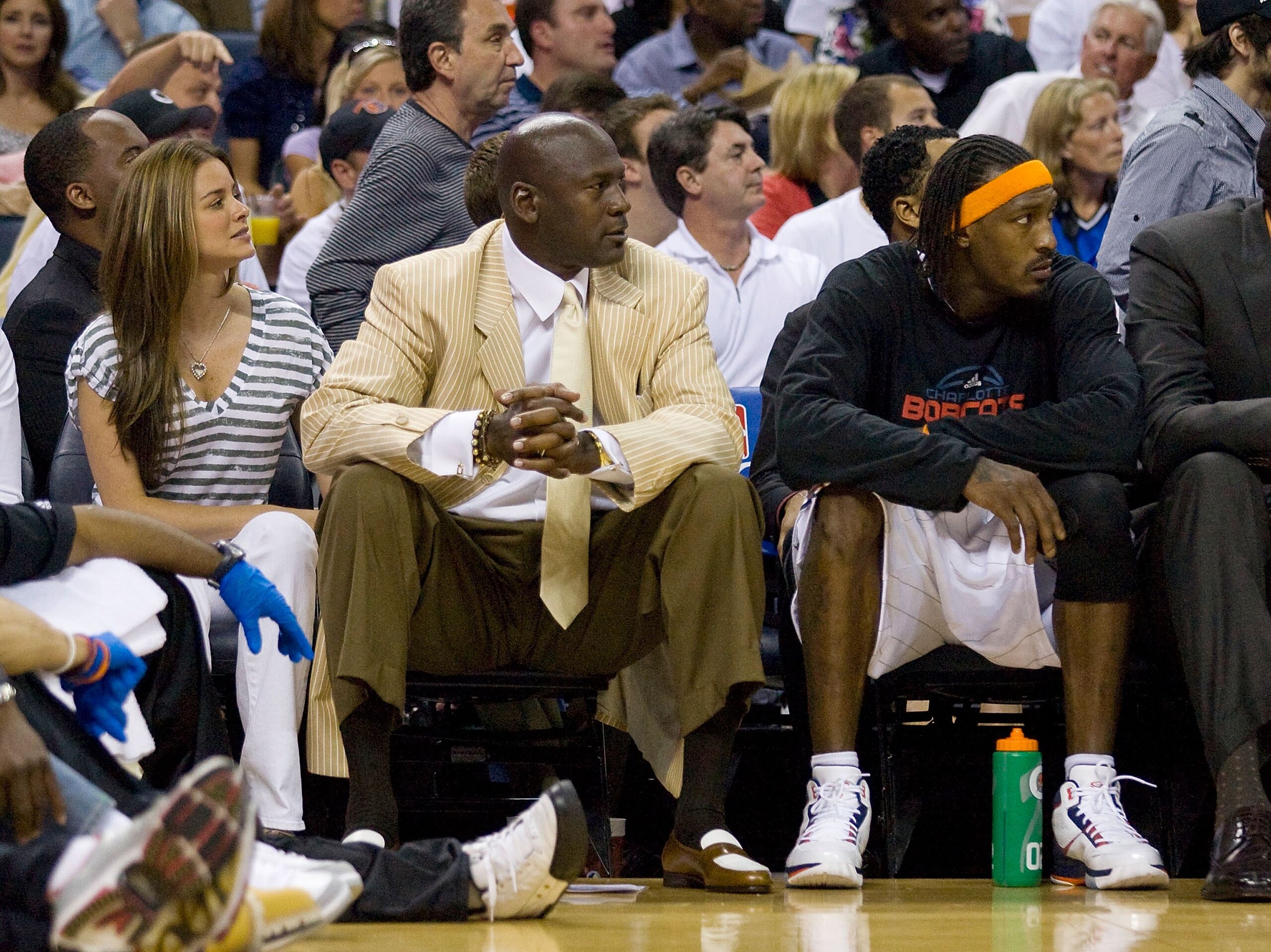 CHARLOTTE, NC - APRIL 26: Charlotte Bobcats owner Michael Jordan (left) and Gerald Wallce #3 watch the play against the Orlando Magic at Time Warner Cable Arena on April 26, 2010 in Charlotte, North Carolina.  The Magic defeated the Bobcats 99-90 to compl